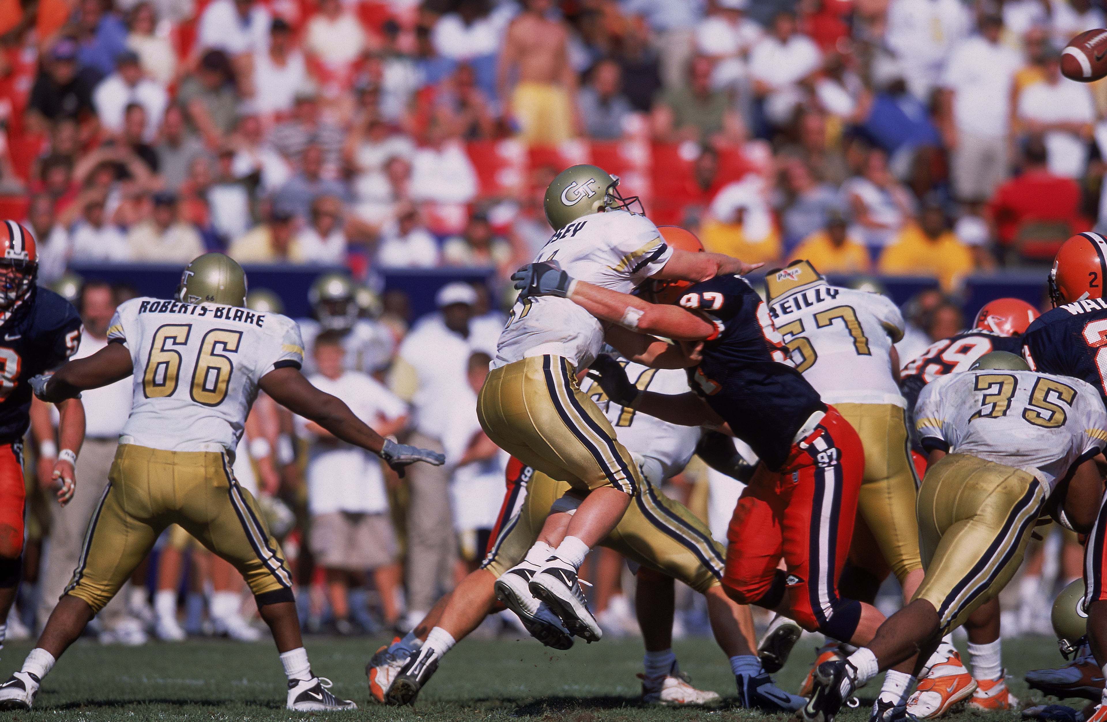 Georgia Tech quarterback George Godsey is tackled by Josh Thomas of Syracuse during a game at the Giants Stadium in East Rutherford, N.J., in 2001. The Yellow Jackets won 13-7. Ezra Shaw / Allsport