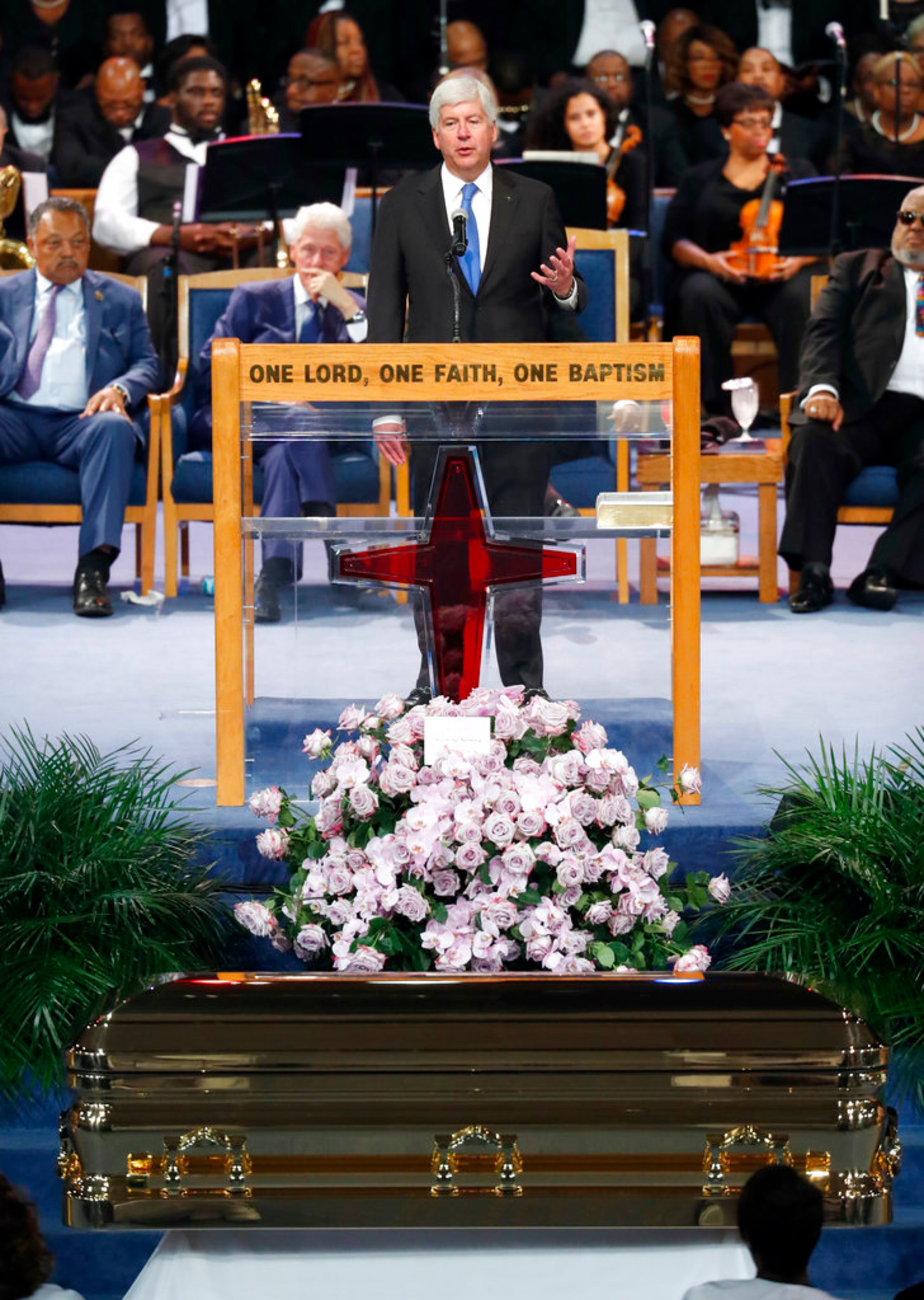 Michigan Gov. Rick Snyder speaks during the funeral service for Aretha Franklin at Greater Grace Temple, Friday, Aug. 31, 2018, in Detroit. Franklin died Aug. 16, 2018 of pancreatic cancer at the age of 76. (AP Photo/Paul Sancya)