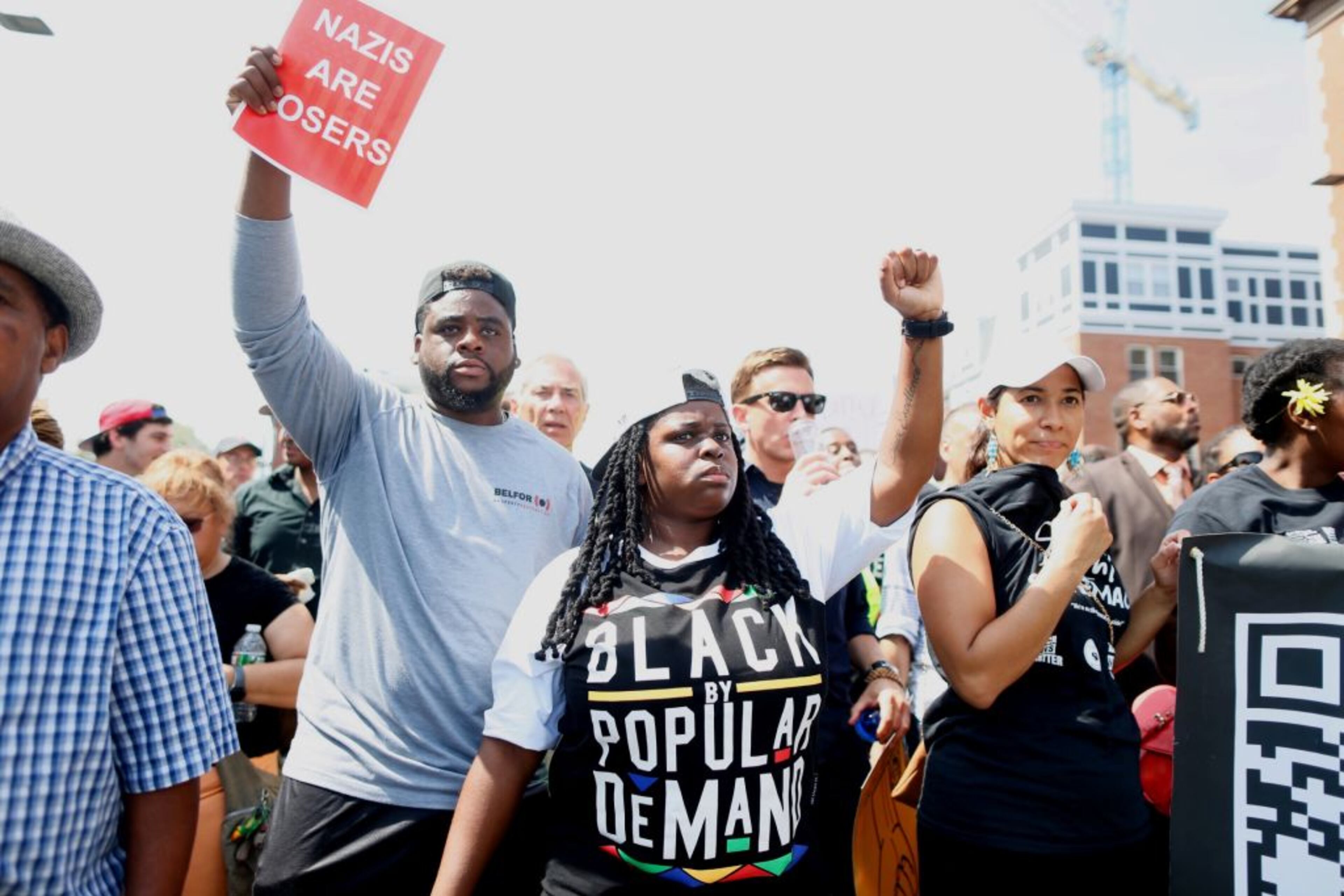 BOSTON, MA - AUGUST 19: Counter protesters hold fists up while marching to a planned 'Free Speech Rally' on Boston Common on August 19, 2017 in Boston, Massachusetts. Thousands of demonstrators and counter-protestors are expected at Boston Common where the Boston Free Speech Rally is being held. (Photo by Scott Eisen/Getty Images)