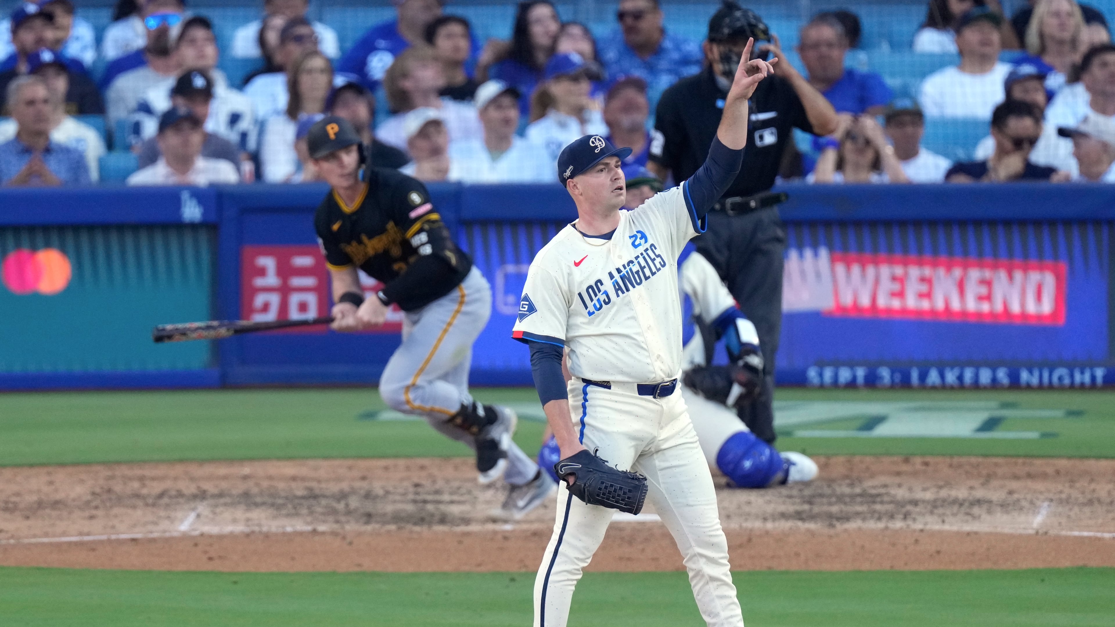 Los Angeles Dodgers starting pitcher Tarik Skubal, right, gestures as Pittsburgh Pirates' Henry Davis flies out during the seventh inning of a baseball game Saturday, Aug. 22, 2026, in Los Angeles. (AP Photo/Mark J. Terrill)