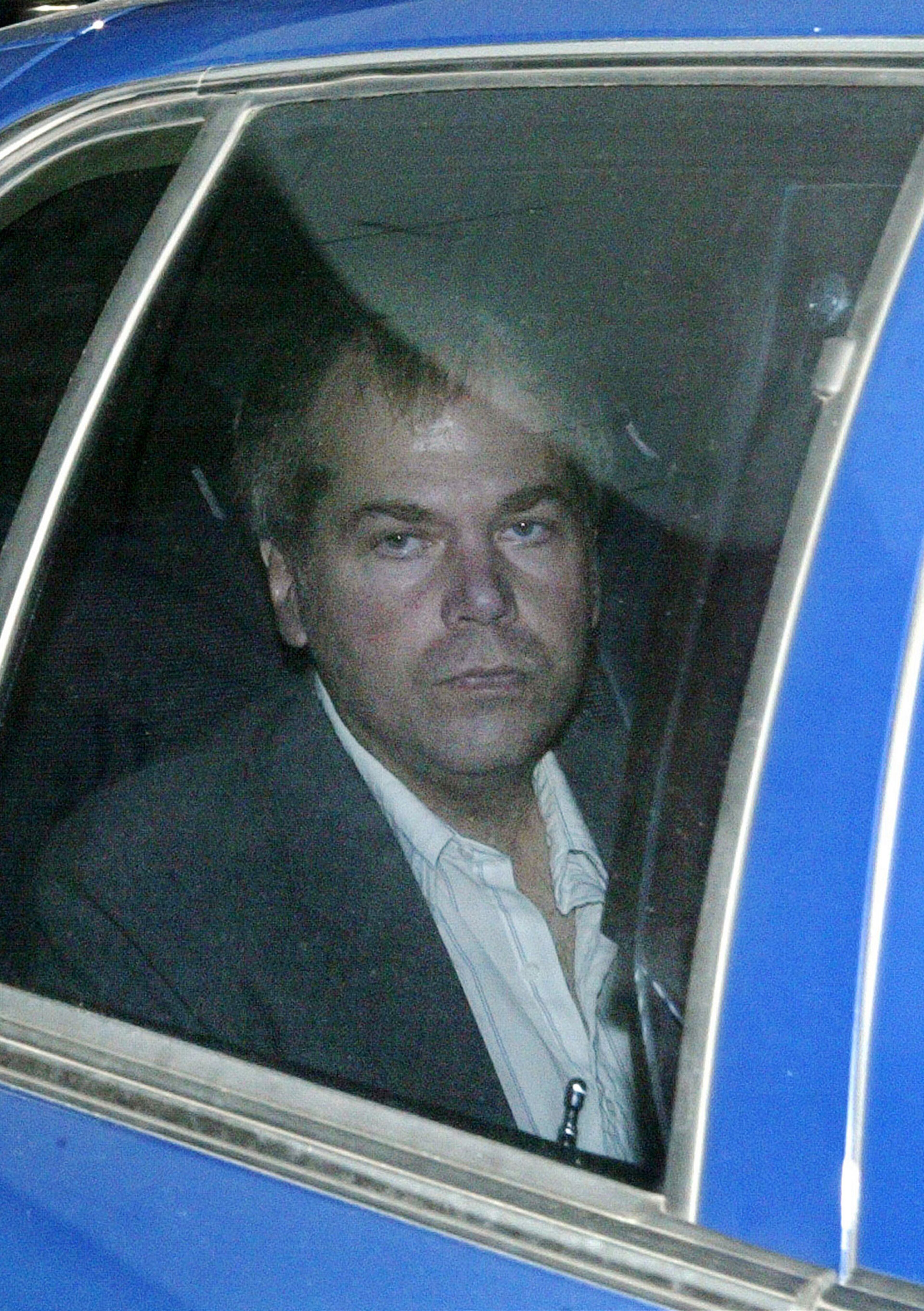 FILE - In a Nov. 18, 2003 file photo, John Hinckley Jr. arrives at U.S. District Court in Washington. Hinckley is being granted additional time away from the Washington psychiatric hospital where he lives. U.S. District Judge Paul Friedman on Wednesday, May 11, 2011 approved an unspecified number of extra visits by John Hinckley to his mother's home in Virginia. Hinckley lives at St. Elizabeth's Hospital in Washington. He was found not guilty by reason of insanity after he tried to assassinate President Ronald Reagan in 1981 as he left a Washington hotel. (AP Photo/Evan Vucci,File)
