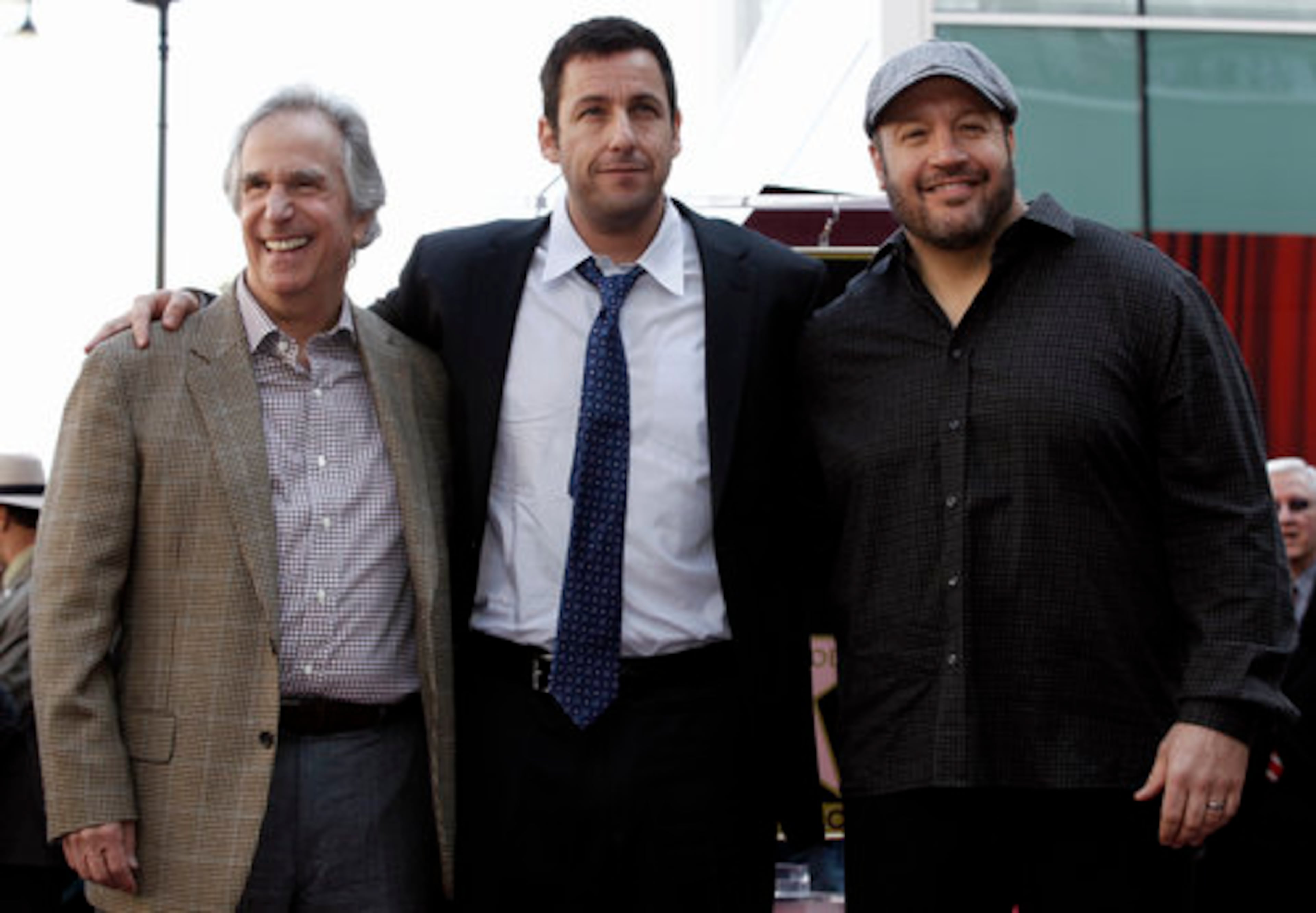 Actors Adam Sandler, Kevin James and Henry Winkler pose together after Sandler received his star.