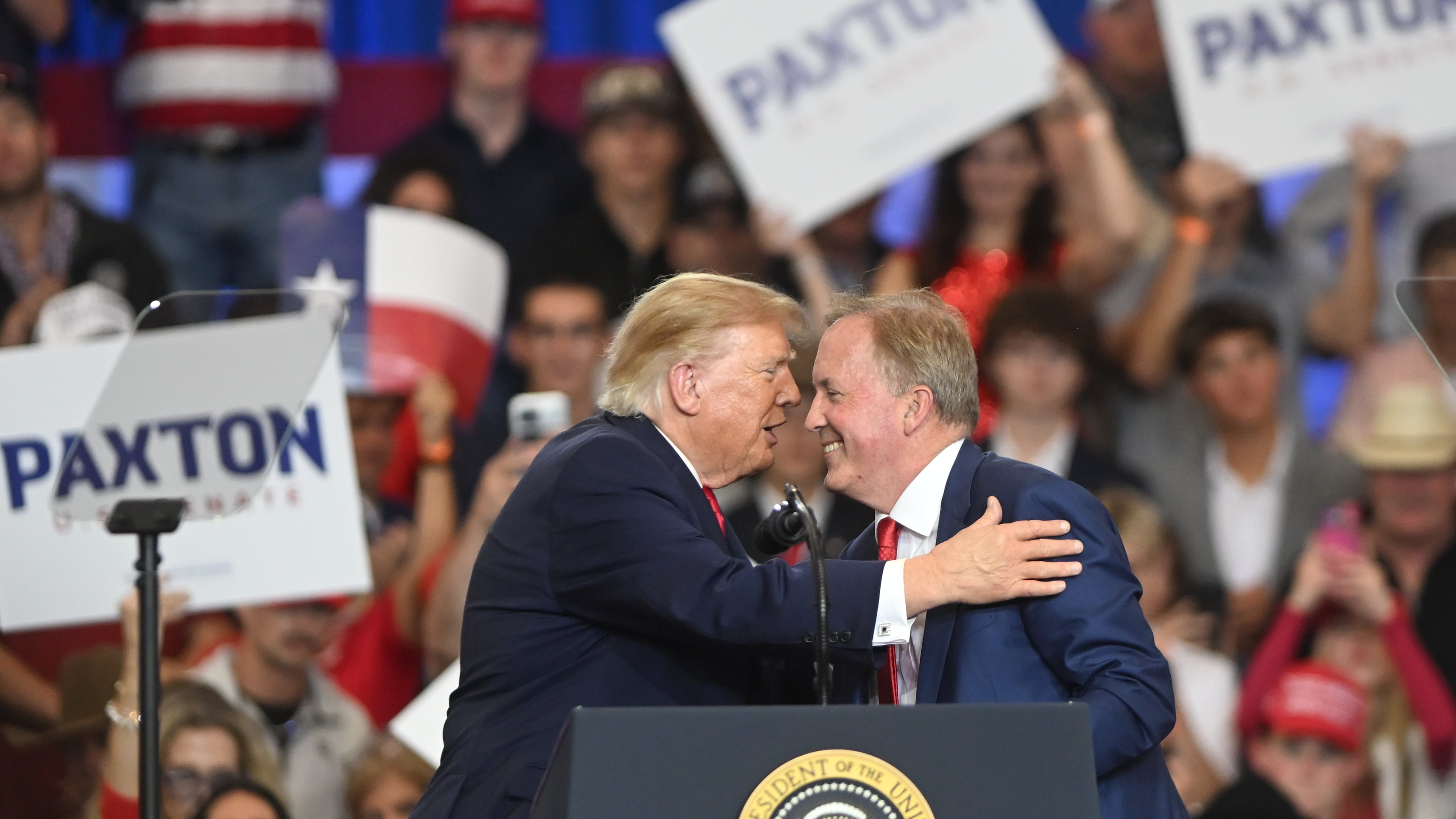 President Donald Trump talks with Senate candidate Texas Attorney General Ken Paxton at a campaign rally at Lubbock Memorial Civic Center, Tuesday, Oct. 27, 2026, in Lubbock, Texas. (AP Photo/Annie Rice)