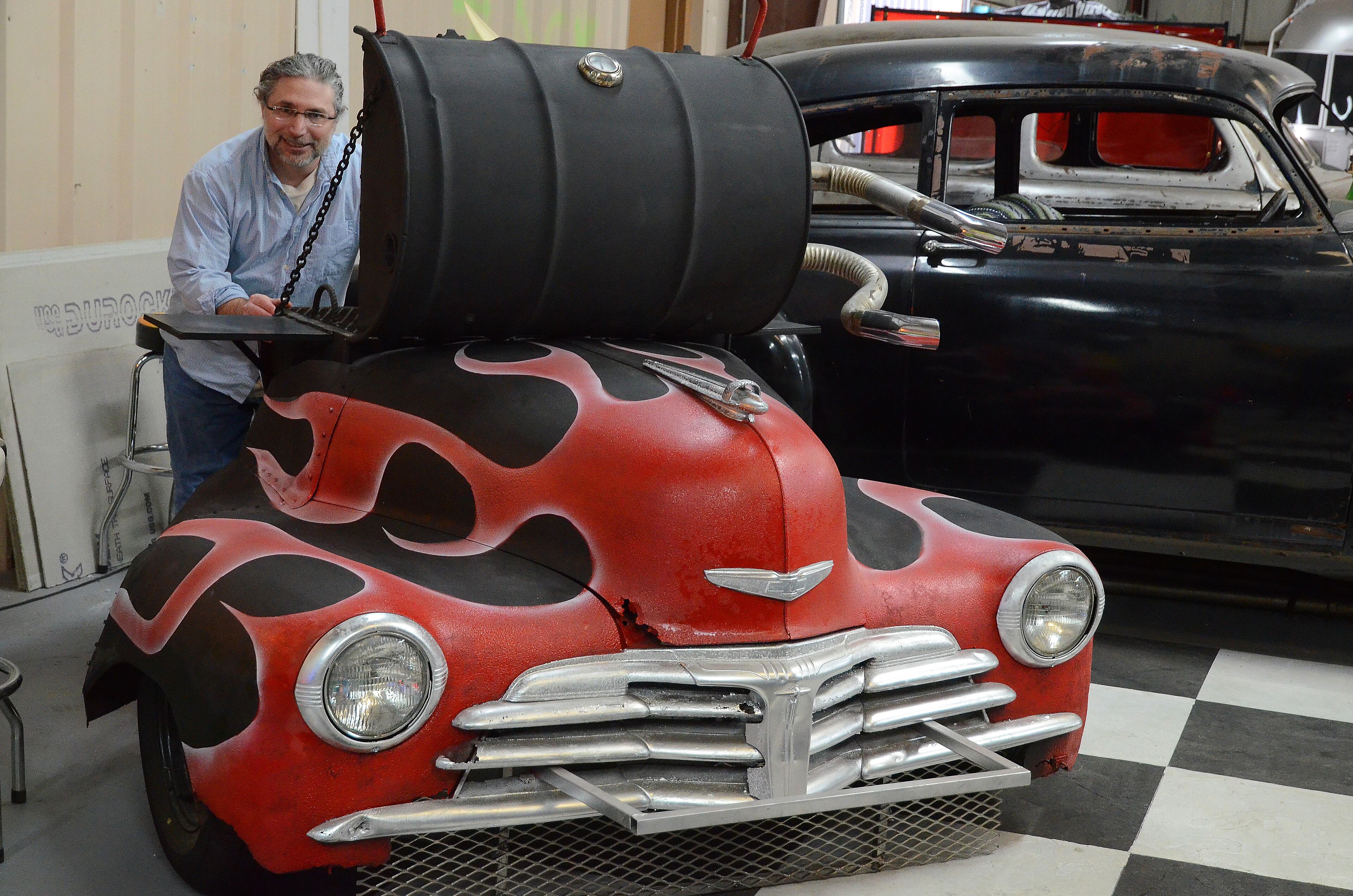 Bernstein shows off a 1947 Chevy grill.