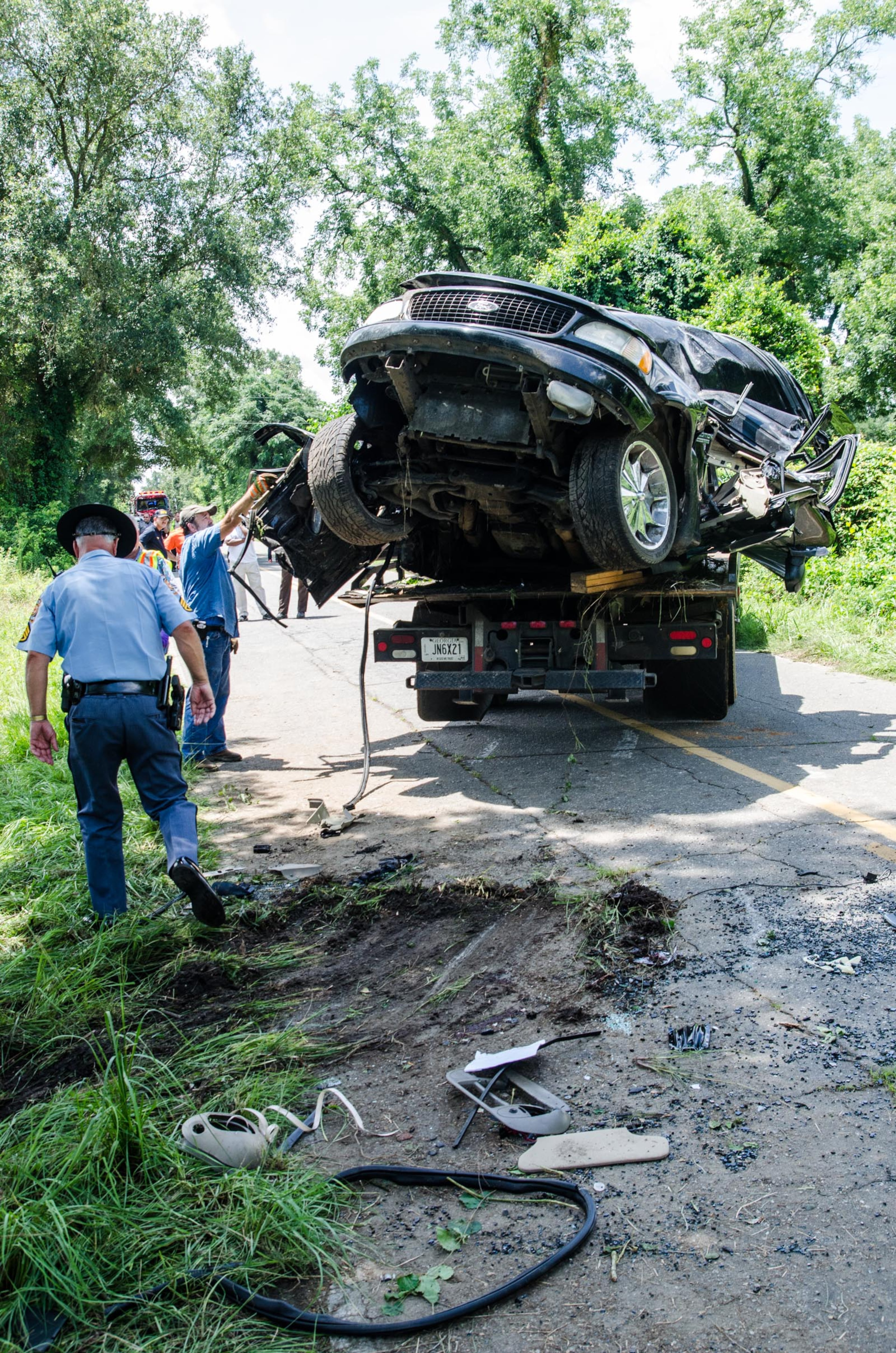 The dead students were identified as rising seniors Jicarre Watkins and Shawn Waters and rising junior Johnnie Parker. A fourth football player was flown to a local hospital where he is in critical condition, school officials said in a press release.
