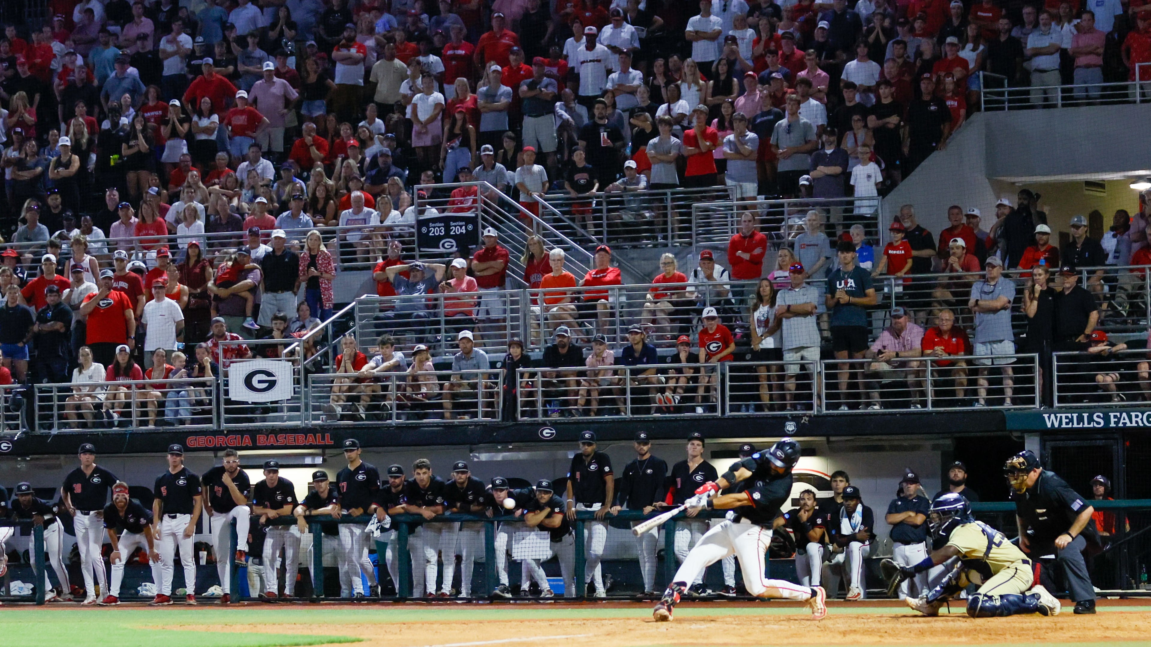 Georgia first baseman Corey Collins hits a two-run RBI double in the 10th inning against Georgia Tech during an NCAA Regional game in Athens in 2024. In a matchup of top 10 teams, the seventh-ranked Bulldogs defeated the third-ranked Yellow Jackets in two straight games to advance to the College World Series. (Miguel Martinez/AJC 2024)
