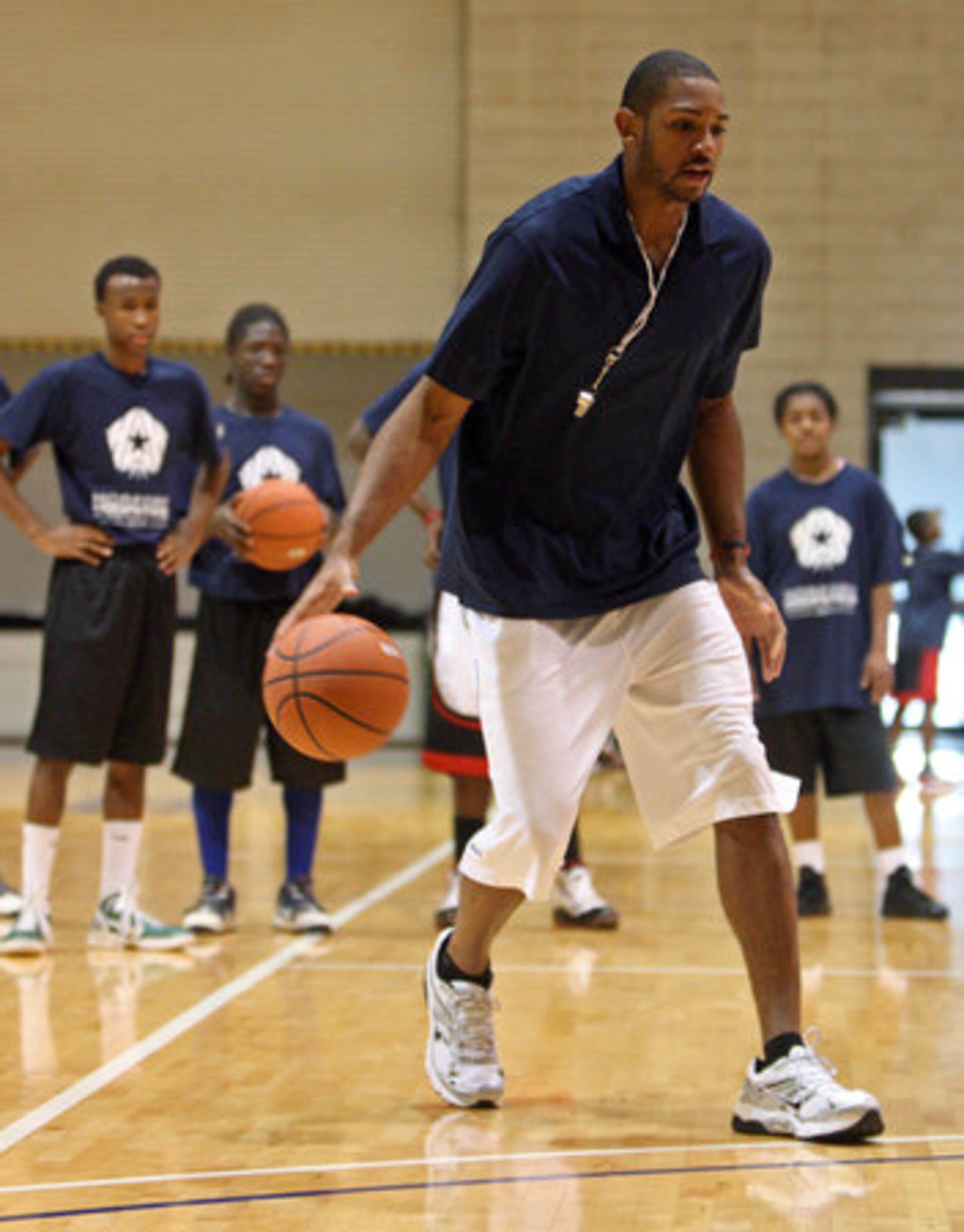 Atlanta Hawks forward Al Horford demonstrates a move in a drill during Horford Hoopstars Basketball Camp. About 120 kids attended the first day of the two-day camp.