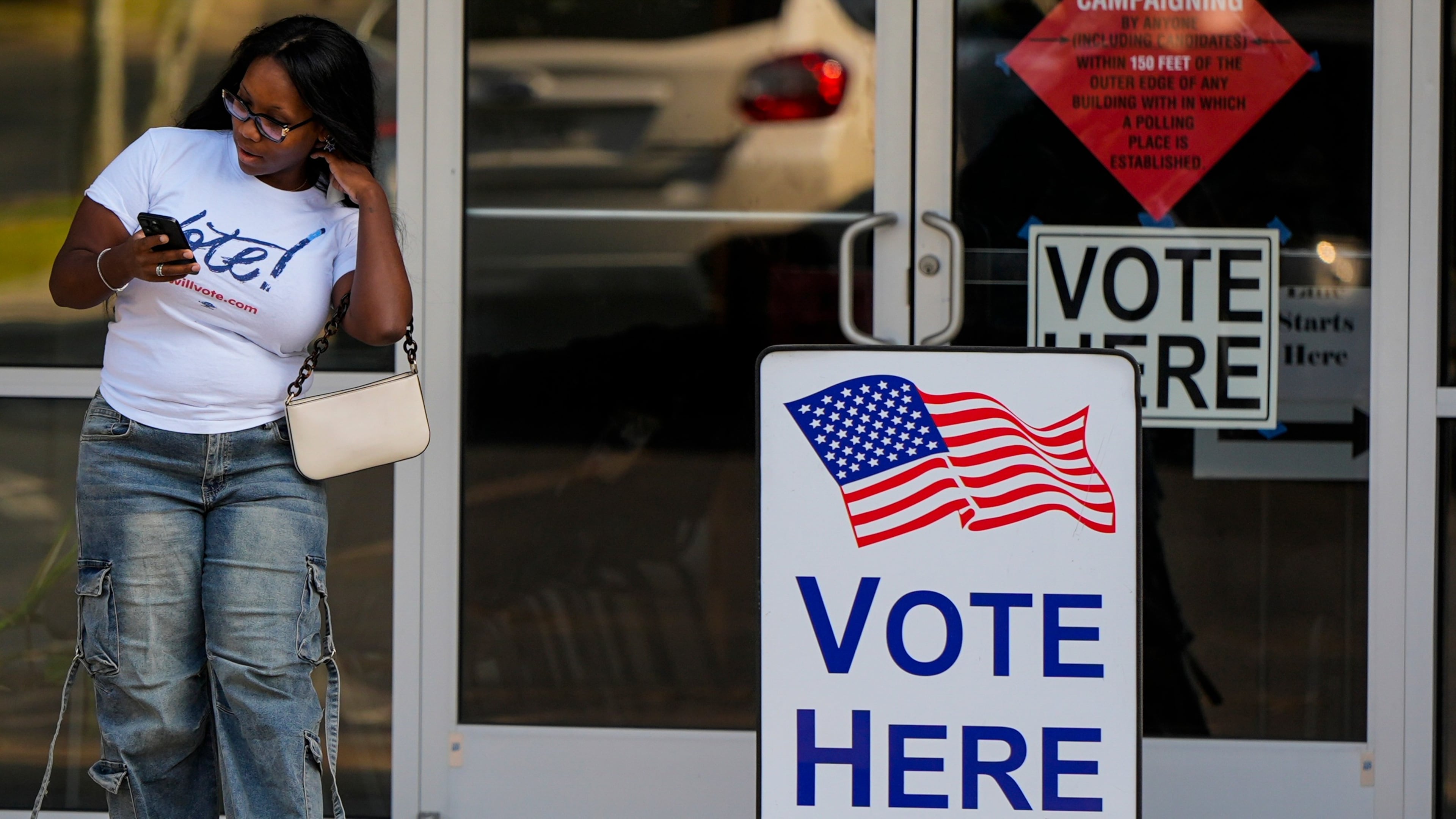 A woman leaves a voting center after casting her ballot in last month's primaries in Marietta. (Mike Stewart/AP)