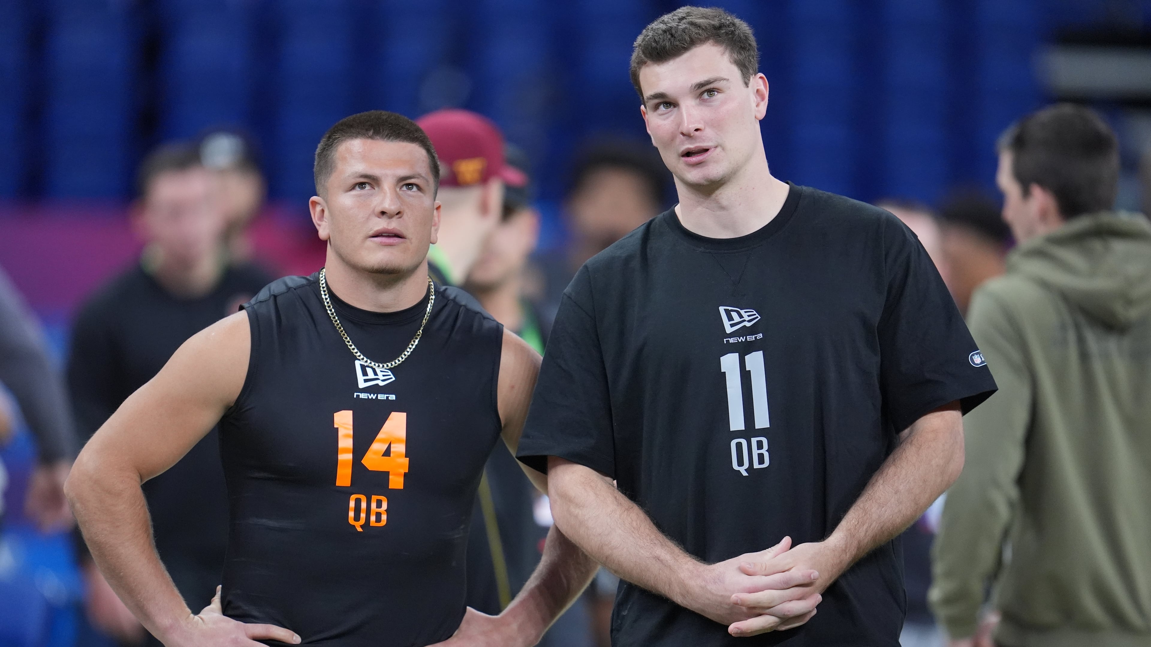 FILE - Vanderbilt quarterback Diego Pavia (14) talks to Indiana quarterback Fernando Mendoza (11) as quarterbacks run a drill at the NFL football scouting combine in Indianapolis, Saturday, Feb. 28, 2026. (AP Photo/Michael Conroy, File)