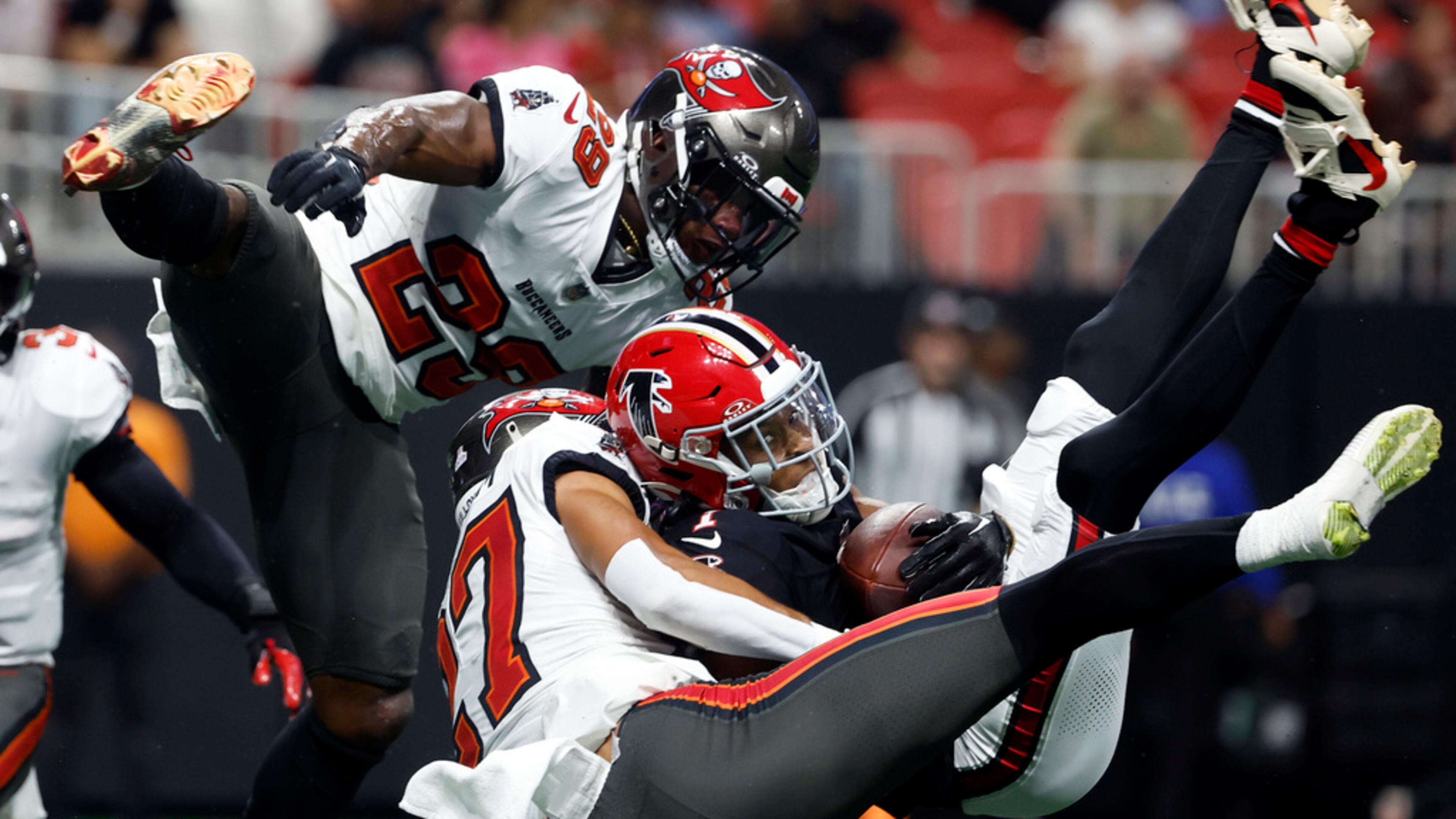 Darnell Mooney (center) had two touchdown catches in the Falcons' overtime win over the Buccaneers on Oct. 3, 2024, in Atlanta. Atlanta beat Tampa Bay twice last year, but the Bucs won the NFC South. (Butch Dill / AP 2024)