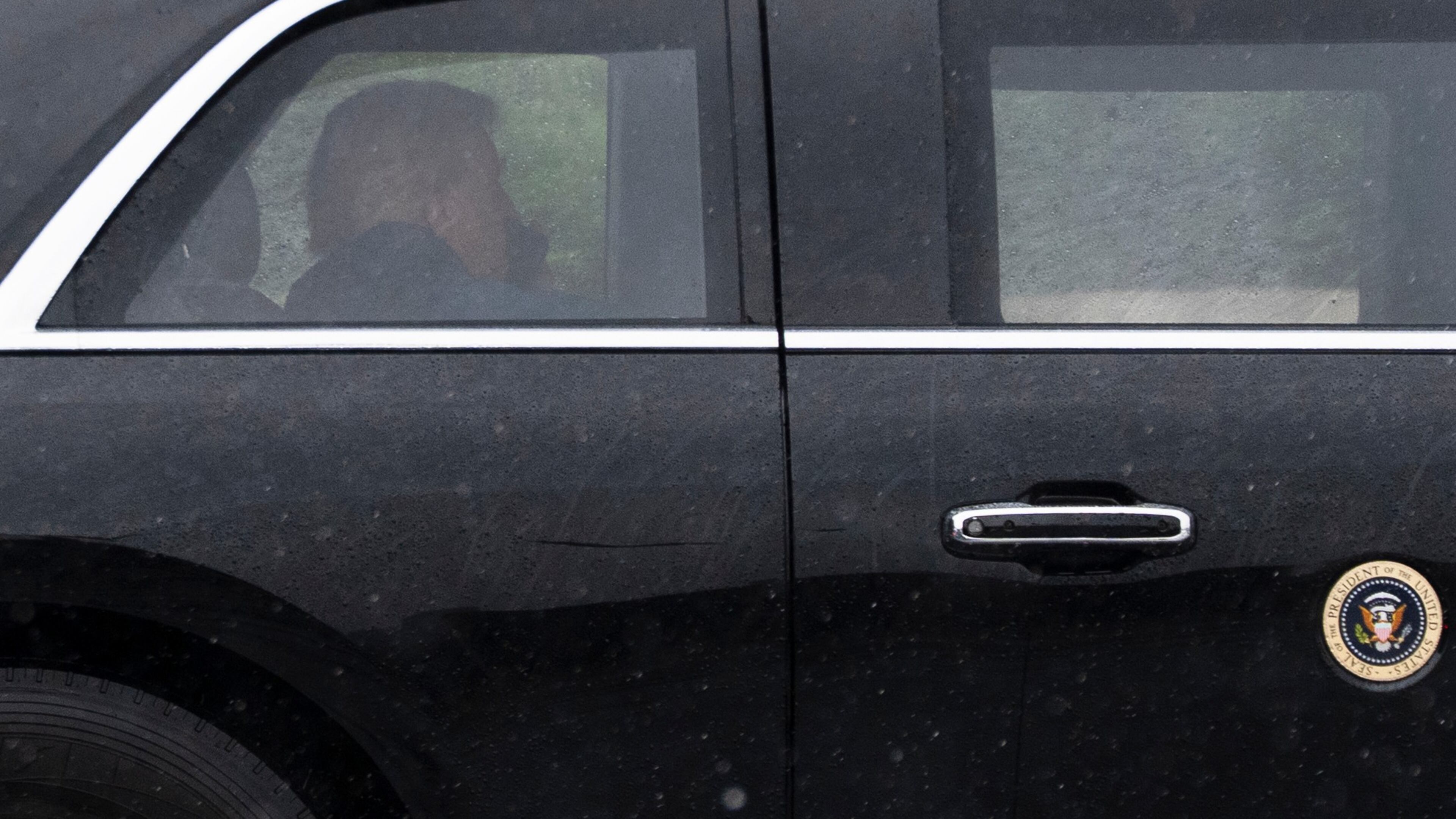 President Donald Trump sits at the back of the presidential limousine as it drives outside the Walter Reed National Military Medical Center from the White House, Tuesday, May 15, 2026 in Bethesda, Md. (AP Photo/Manuel Balce Ceneta)