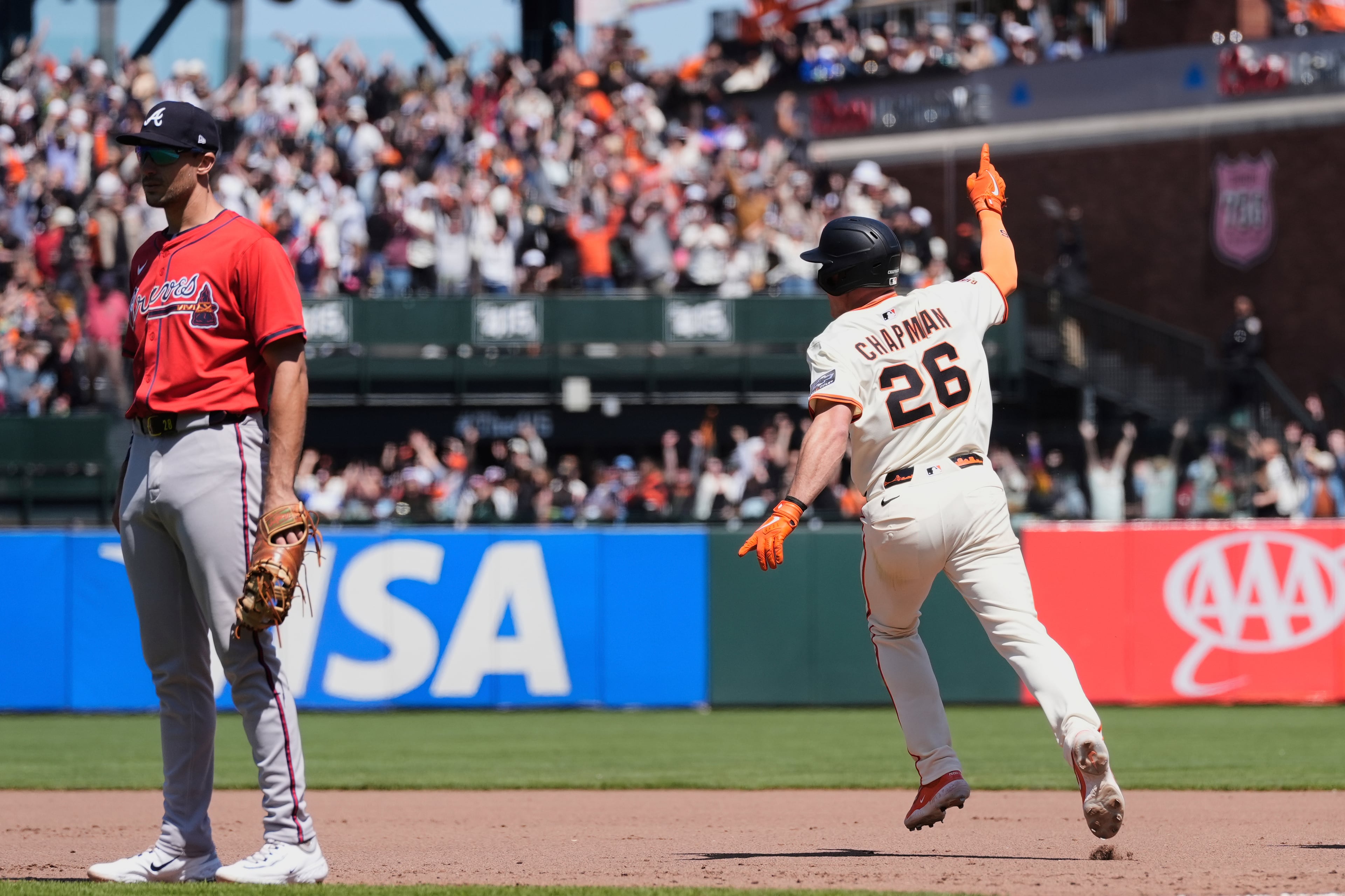 San Francisco Giants' Matt Chapman (26) celebrates as he runs the bases following his game-winning, two-run home run against the Atlanta Braves during the ninth inning of a baseball game Saturday, June 7, 2025, in San Francisco. (AP Photo/Godofredo A. Vásquez)