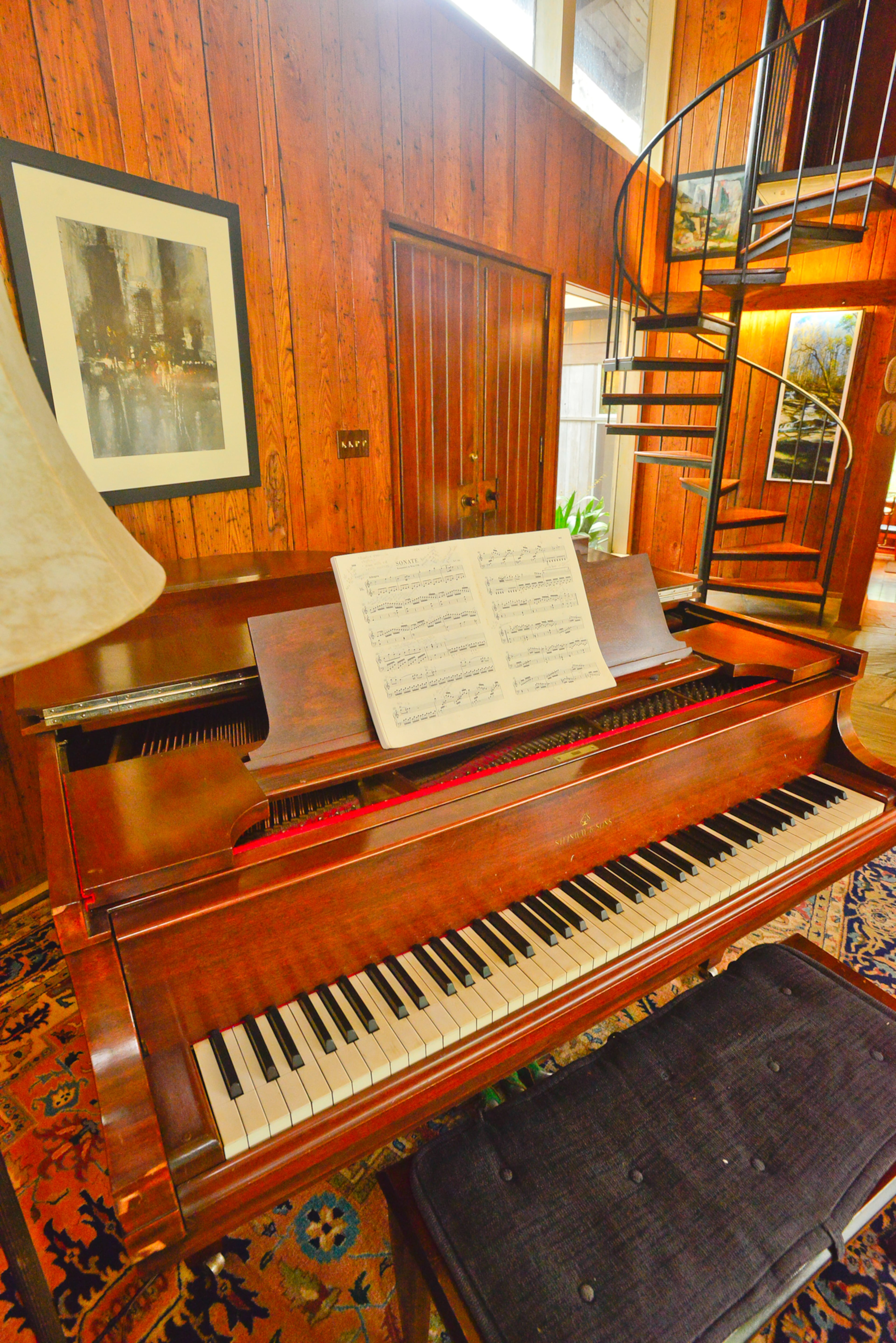 The Steinway piano holds a prominent spot at the entryway. Homeowner Mary Emma McConaughey's mother passed down the piano, which Mary Emma used in her earlier singing career. Now, her grandchildren practice on it.