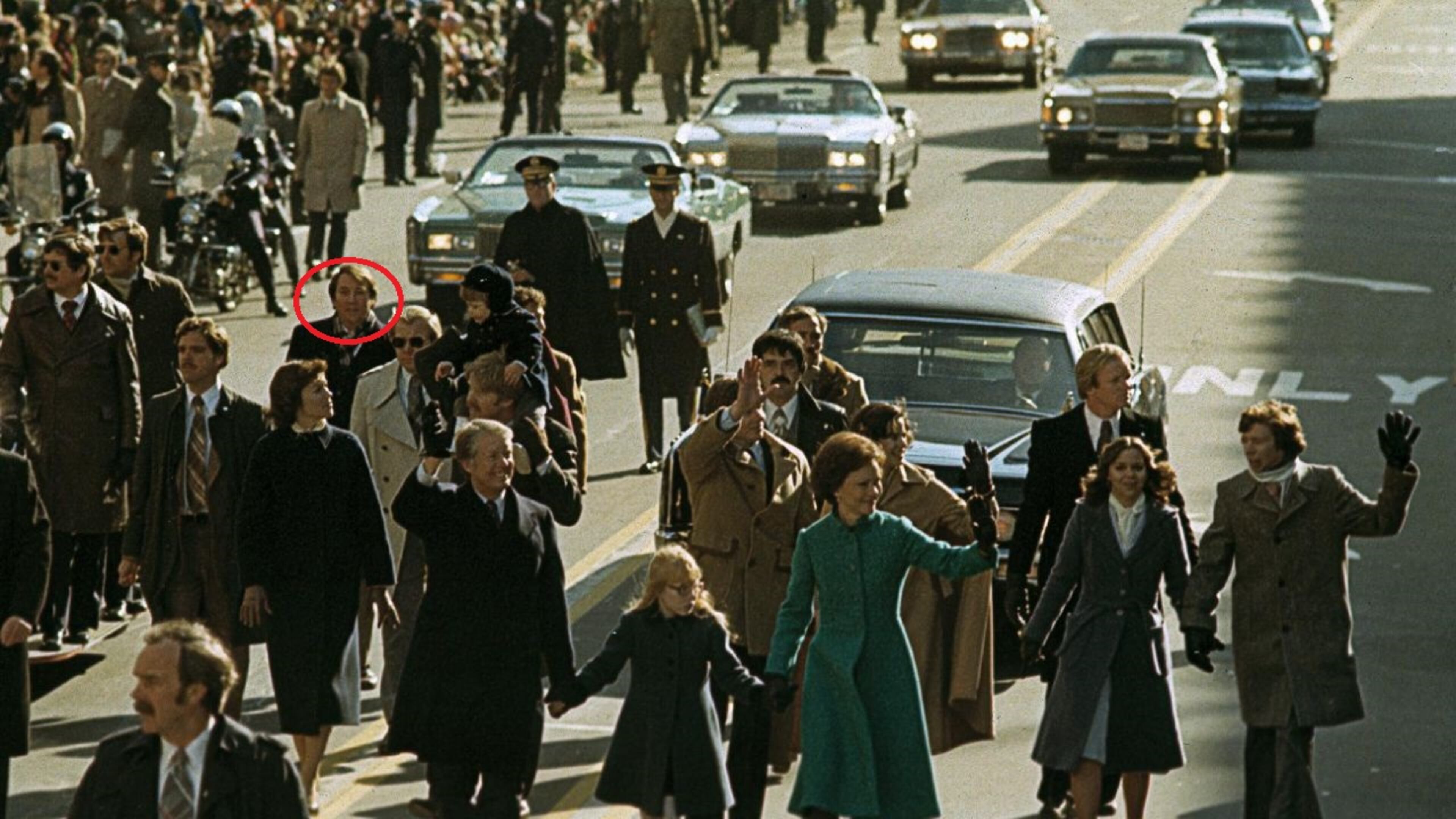 Newly elected President Jimmy Carter and his family walk down Pennsylvania Avenue in Washington in 1977. The face circled in red belongs to Frank Moore, a deputy campaign manager who was part of the Carter transition team. AP file
