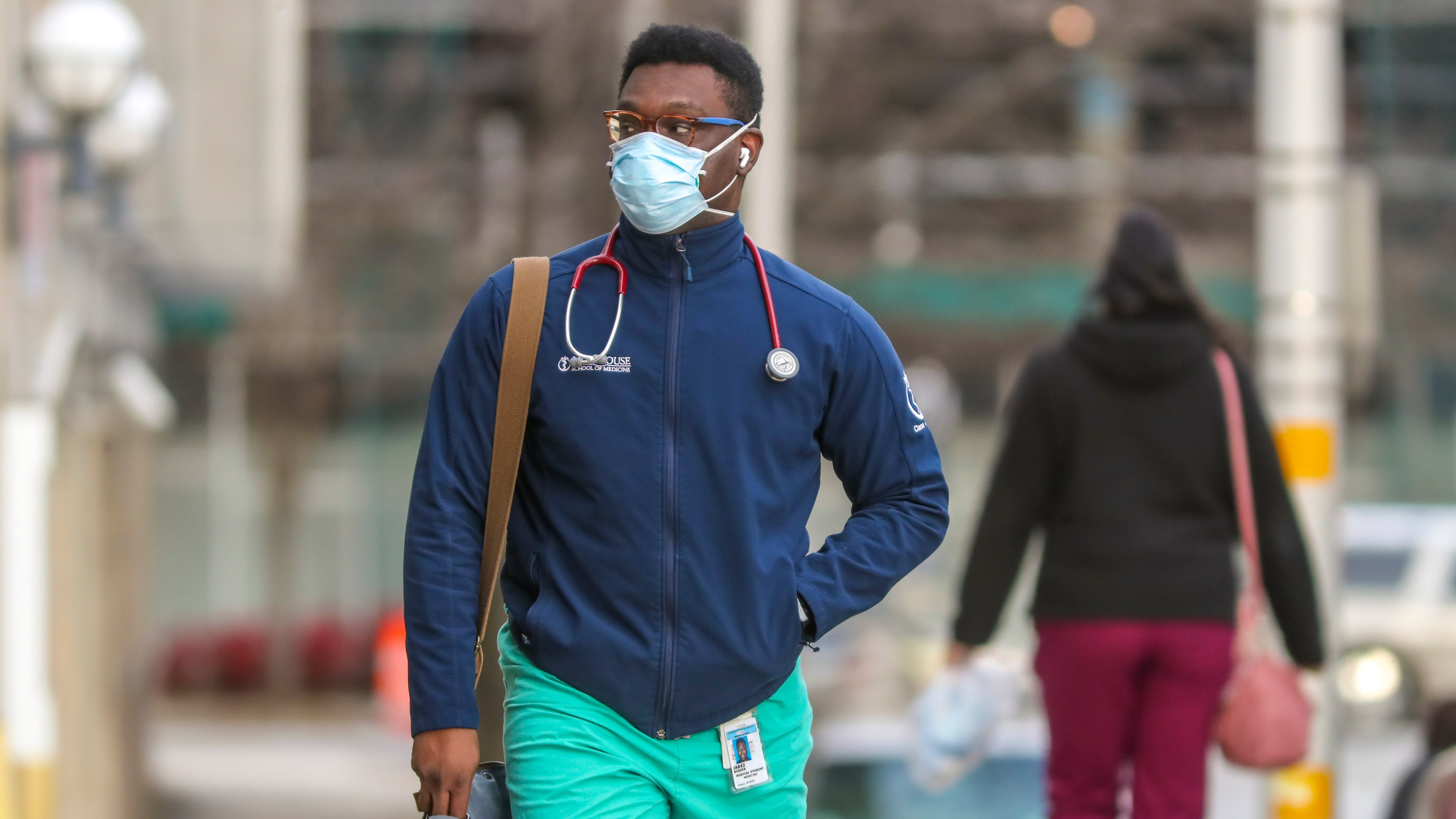 A Morehouse School of Medicine student walks to Grady Memorial Hospital on Feb. 2, 2021. (John Spink/AJC)