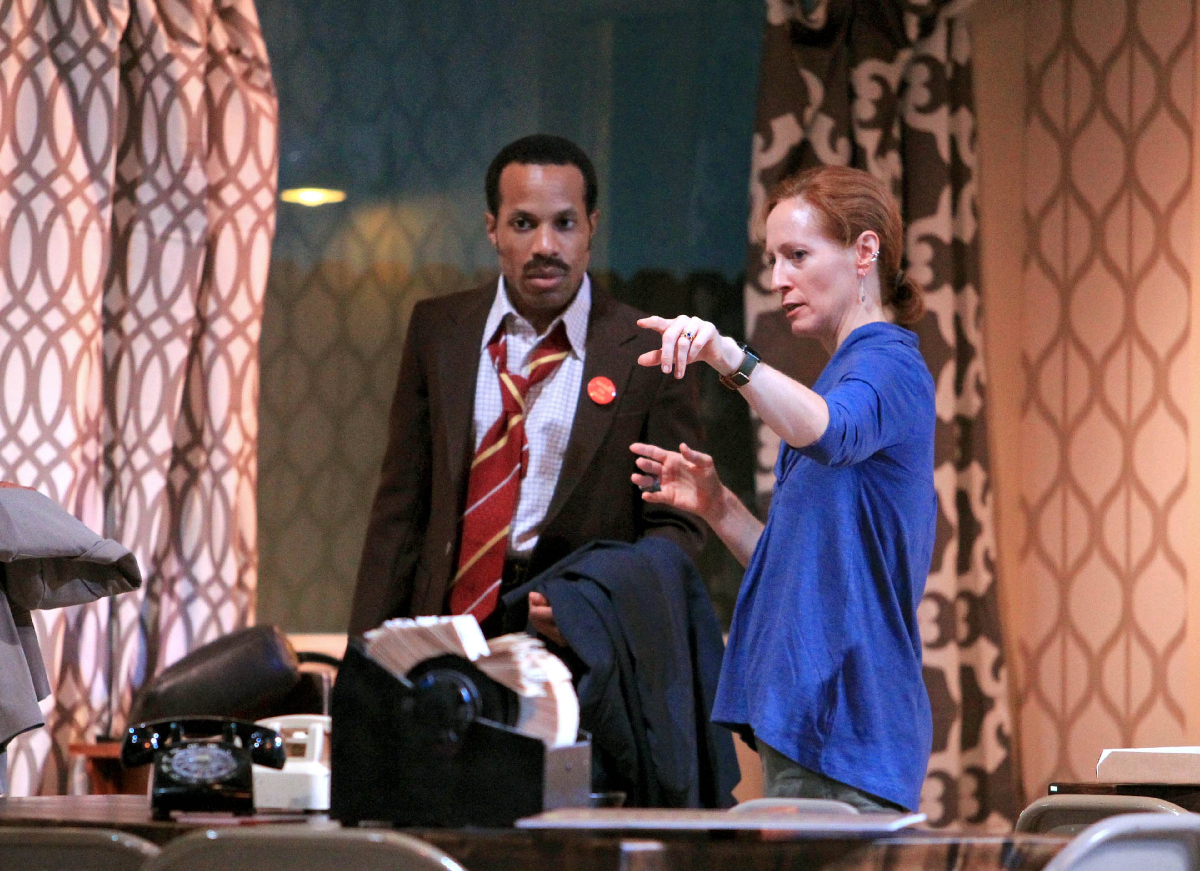Director Susan Booth, right, talks with actor Eugene H. Russell IV about a scene during a dress rehearshal of, "What I Learned in Paris." Russell is portraying John Stanton in the production.
