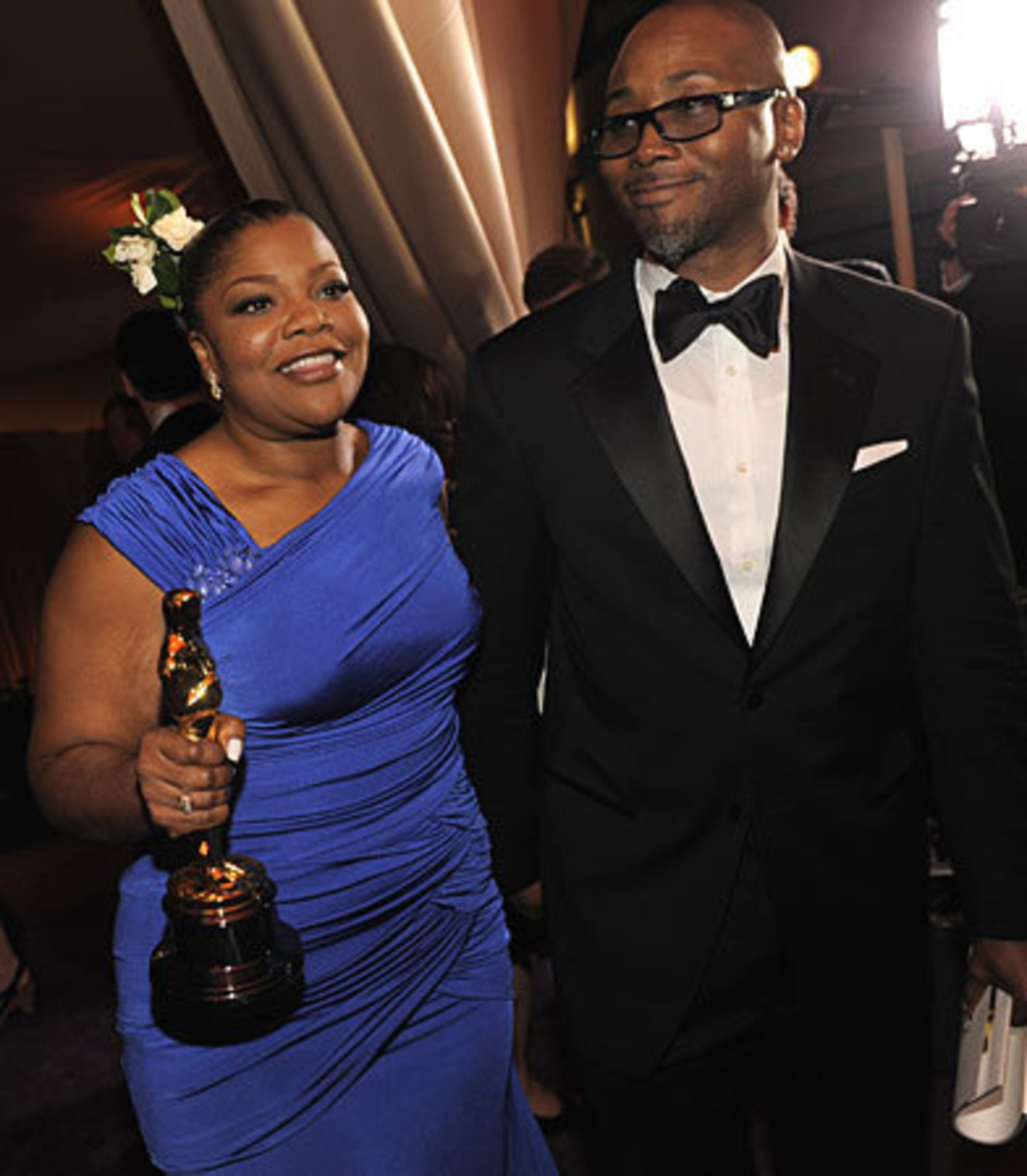 Oscar winner Mo'Nique sports a smile a mile wide as she arrives with her husband Sidney Hicks.