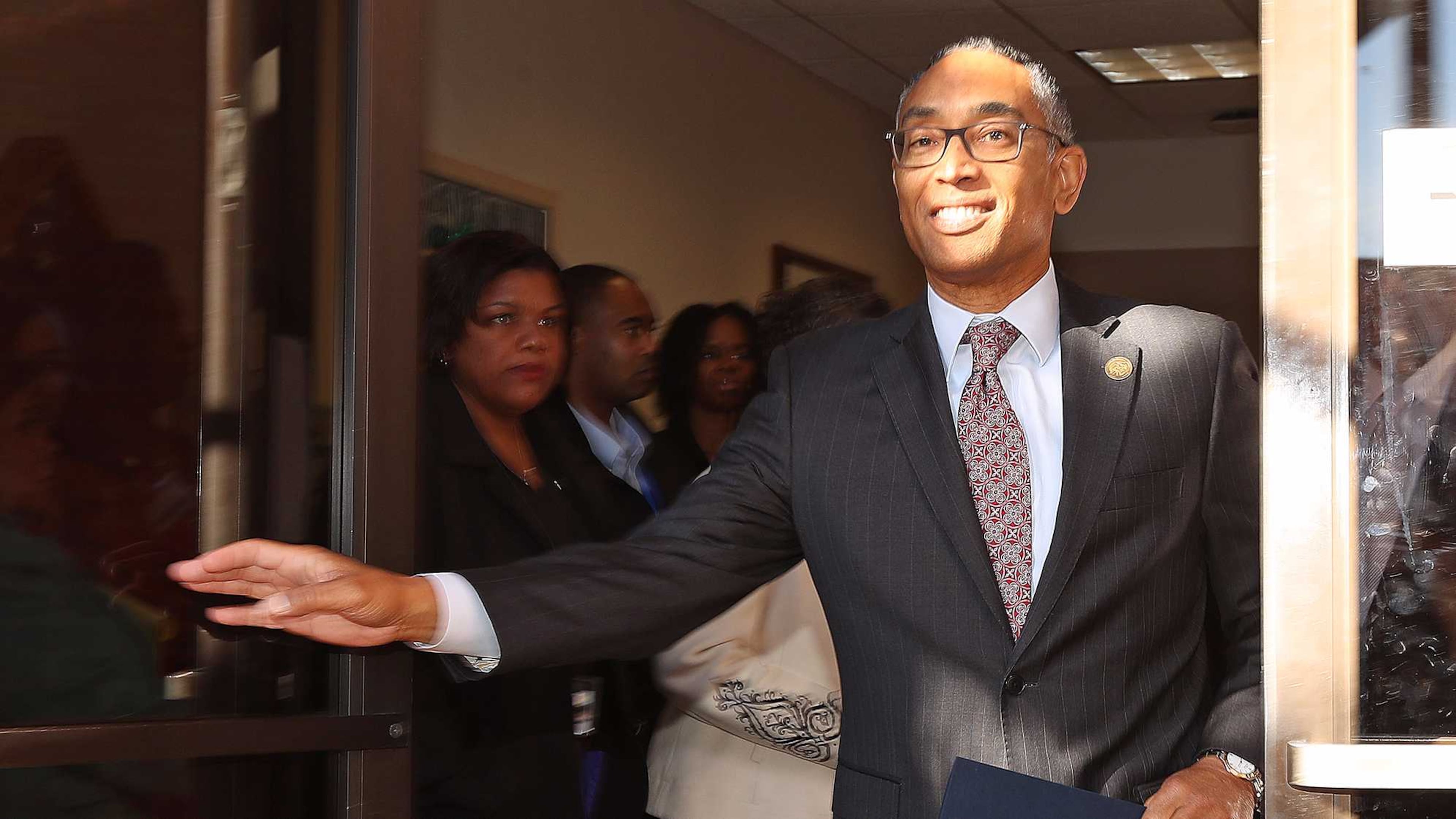 DeKalb County CEO Burrell Ellis walks out of the Manuel Maloof Center for his term-ending press conference on Dec. 29 in Decatur. Curtis Compton/ccompton@ajc.com