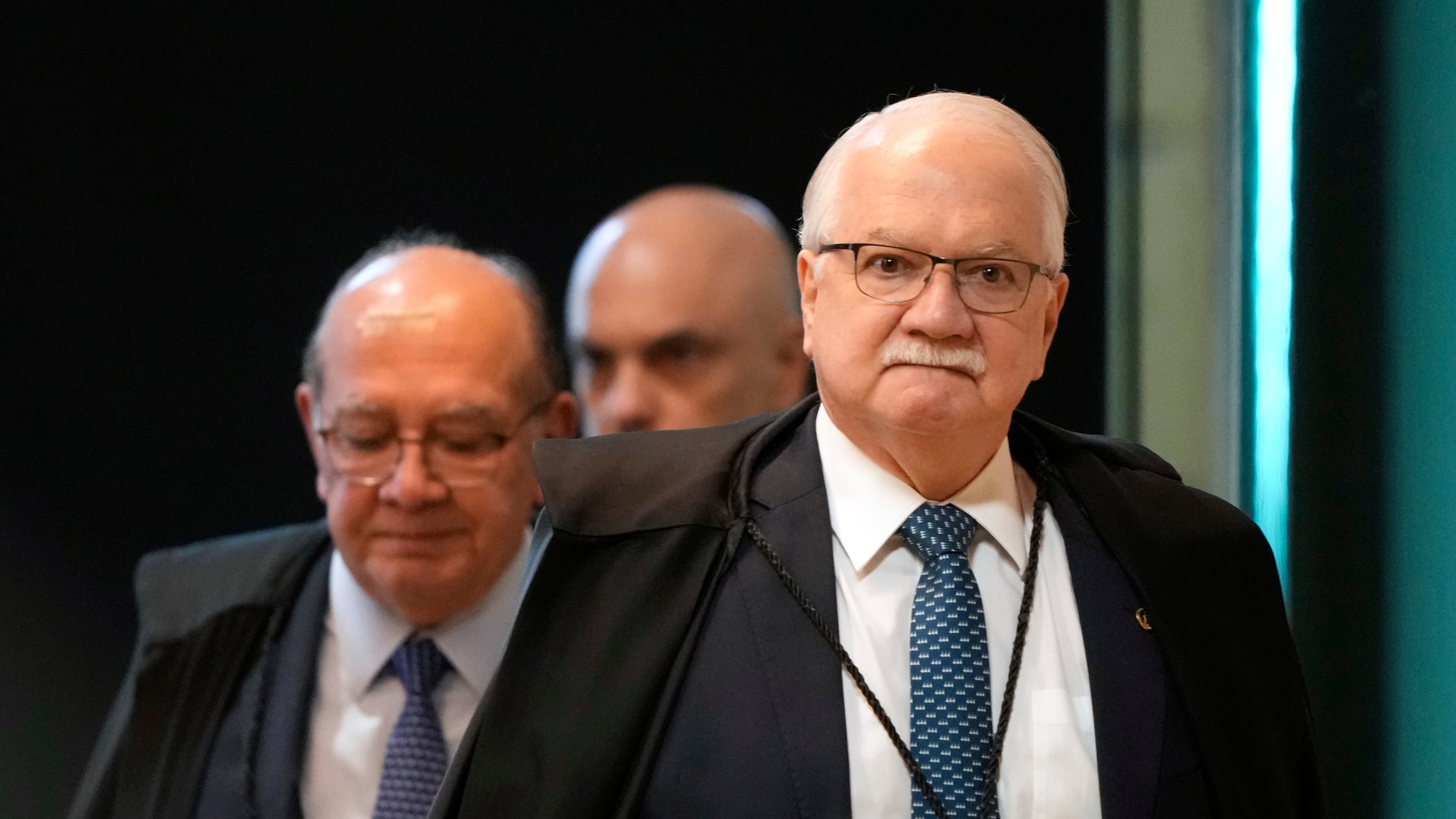 Supreme Court President Justice Edson Fachin, front, arrives to preside over a plenary session of the court in Brasilia, Brazil, Wednesday, Sept. 2, 2026. (AP Photo/Eraldo Peres)