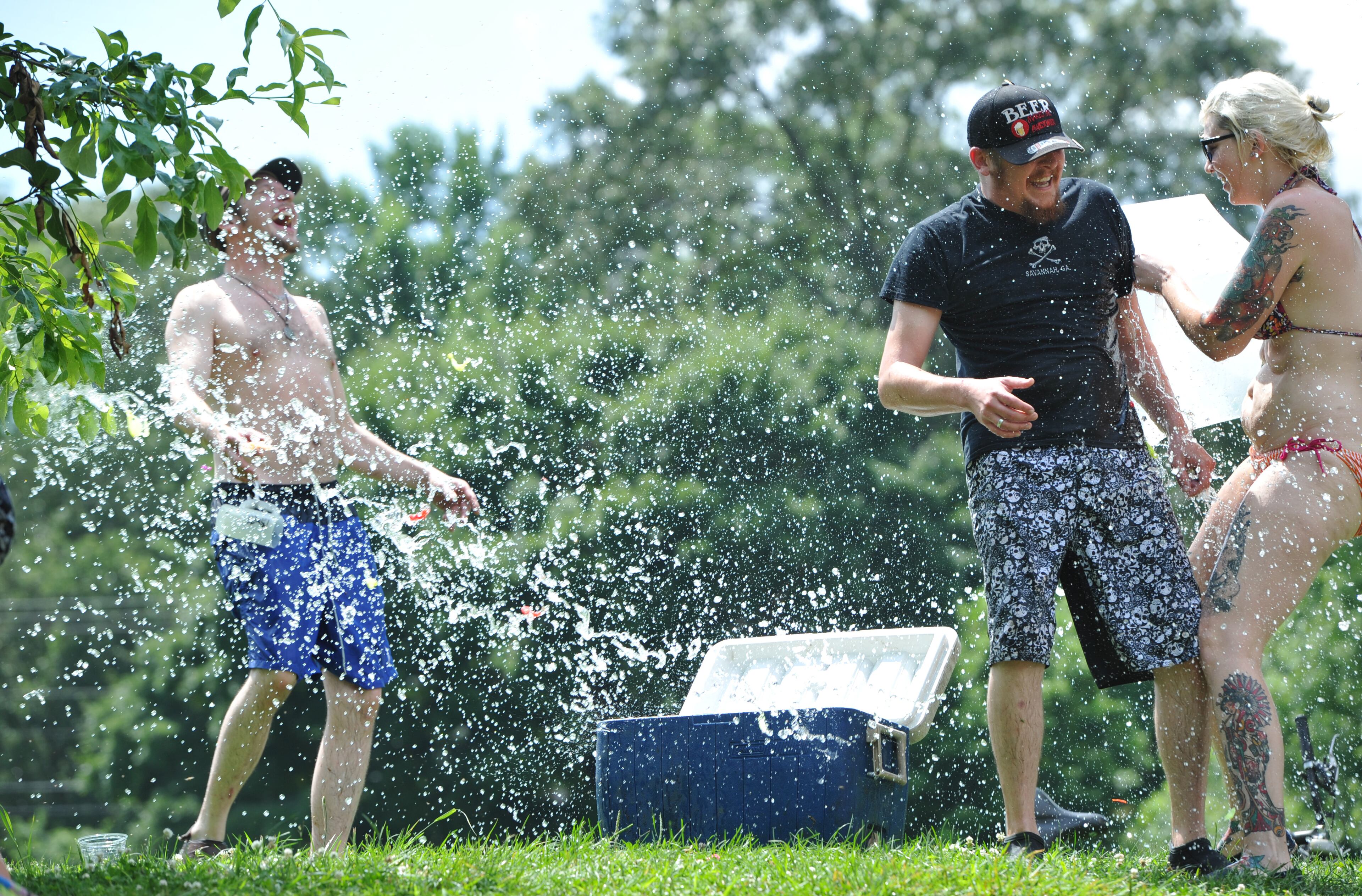 June 14, 2014 Atlanta - Event participants throw water balloons during 4th Annual BIG Ass Water Balloon Fight at Candler Park on Saturday, June 13, 2014. Although over 550 people RSVP'd on Facebook, only about 100 water fight loving Atlantans showed up to Candler Park on June 14th for the 4th Annual Big Ass Water Balloon Fight". Water balloons, buckets, and water guns ran rampant during the friendly fight. HYOSUB SHIN / HSHIN@AJC.COM