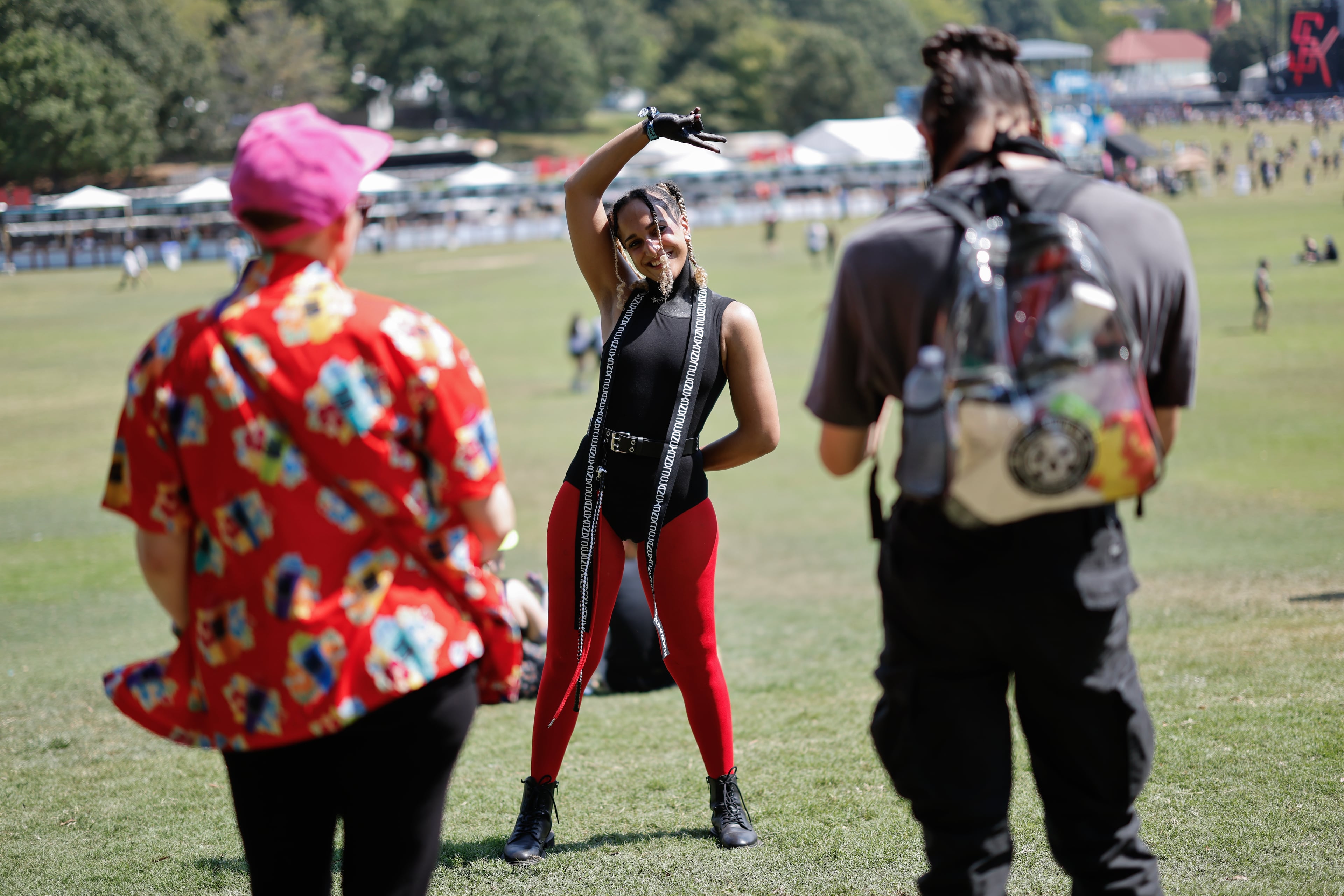 Victoria Ashton poses for friends during the Shaky Knees music festival at Piedmont Park, Saturday, Sept. 19, 2026, in Atlanta. (Erik S. Lesser for the AJC)