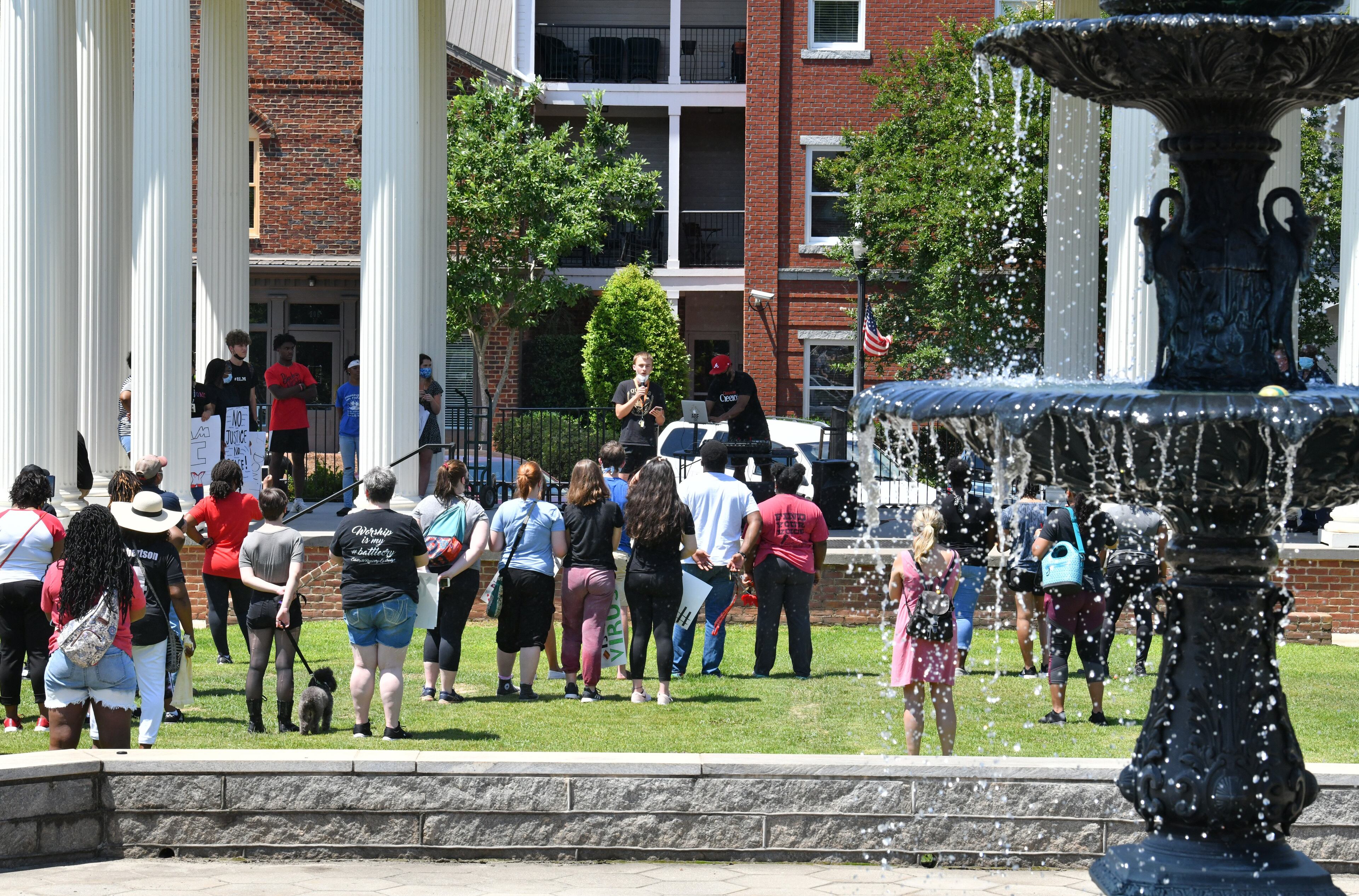 June 19, 2020 Madison - About 200 Morgan County residents gathered at the Town Park in downtown Madison before a peaceful, youth-led march on Friday, June 19, 2020. As protests in response to the death of George Floyd spread nationwide earlier this month, they started to pop up in some unexpected places: namely, the Atlanta exurbs, places like Cartersville, Peachtree City, Forsyth County, Braselton and Madison -- the predominantly white town about an hour east on I-20, whose main street is still lined with antebellum homes that Gen. Sherman purportedly found too beautiful to burn. (Hyosub Shin / Hyosub.Shin@ajc.com)