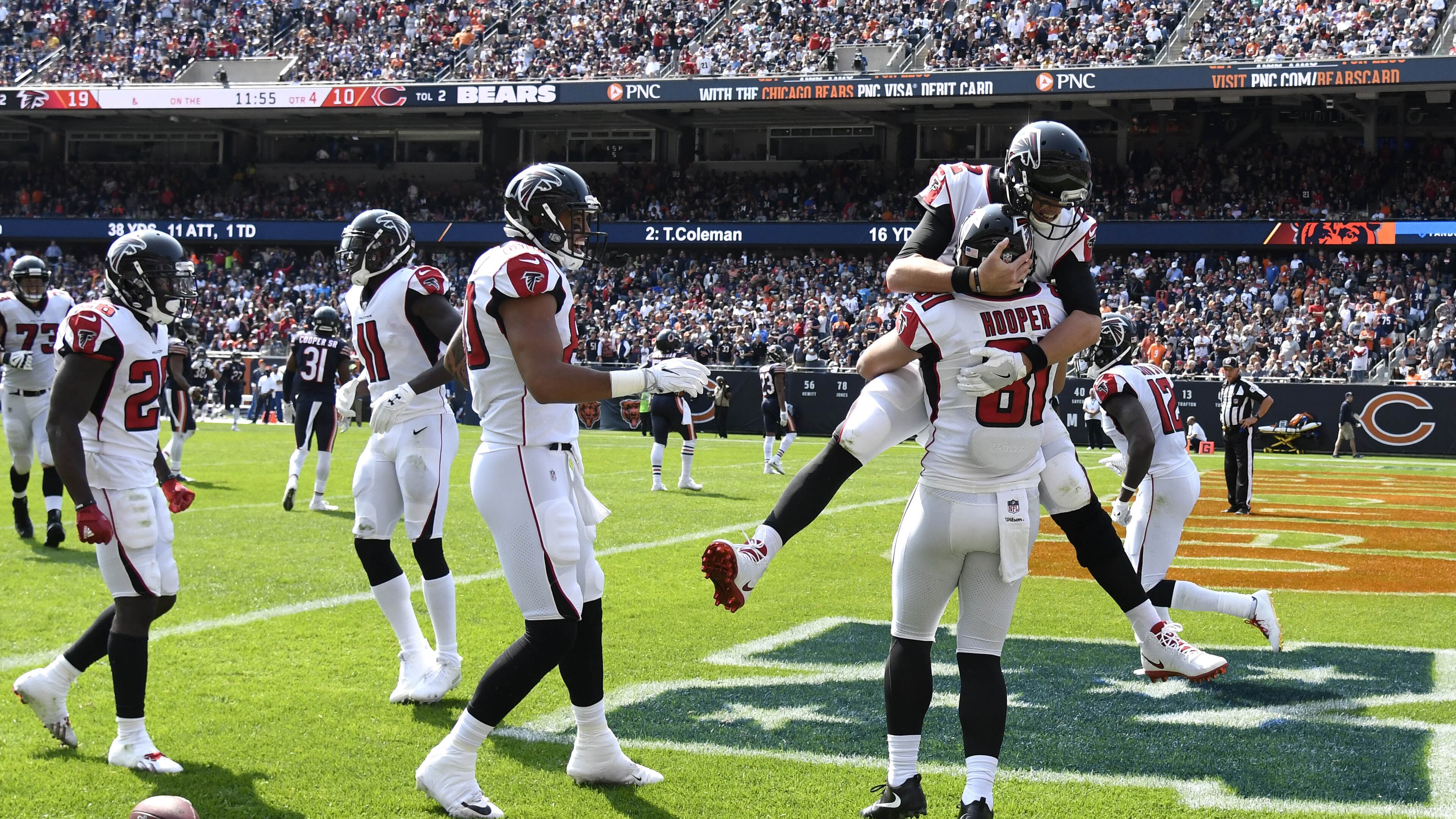 CHICAGO, IL - SEPTEMBER 10: Quarterback Matt Ryan #2 of the Atlanta Falcons celebrates with Austin Hooper #81 after Hooper scored a touchdown in the fourth quarter against the Chicago Bears at Soldier Field on September 10, 2017 in Chicago, Illinois. (Photo by David Banks/Getty Images)