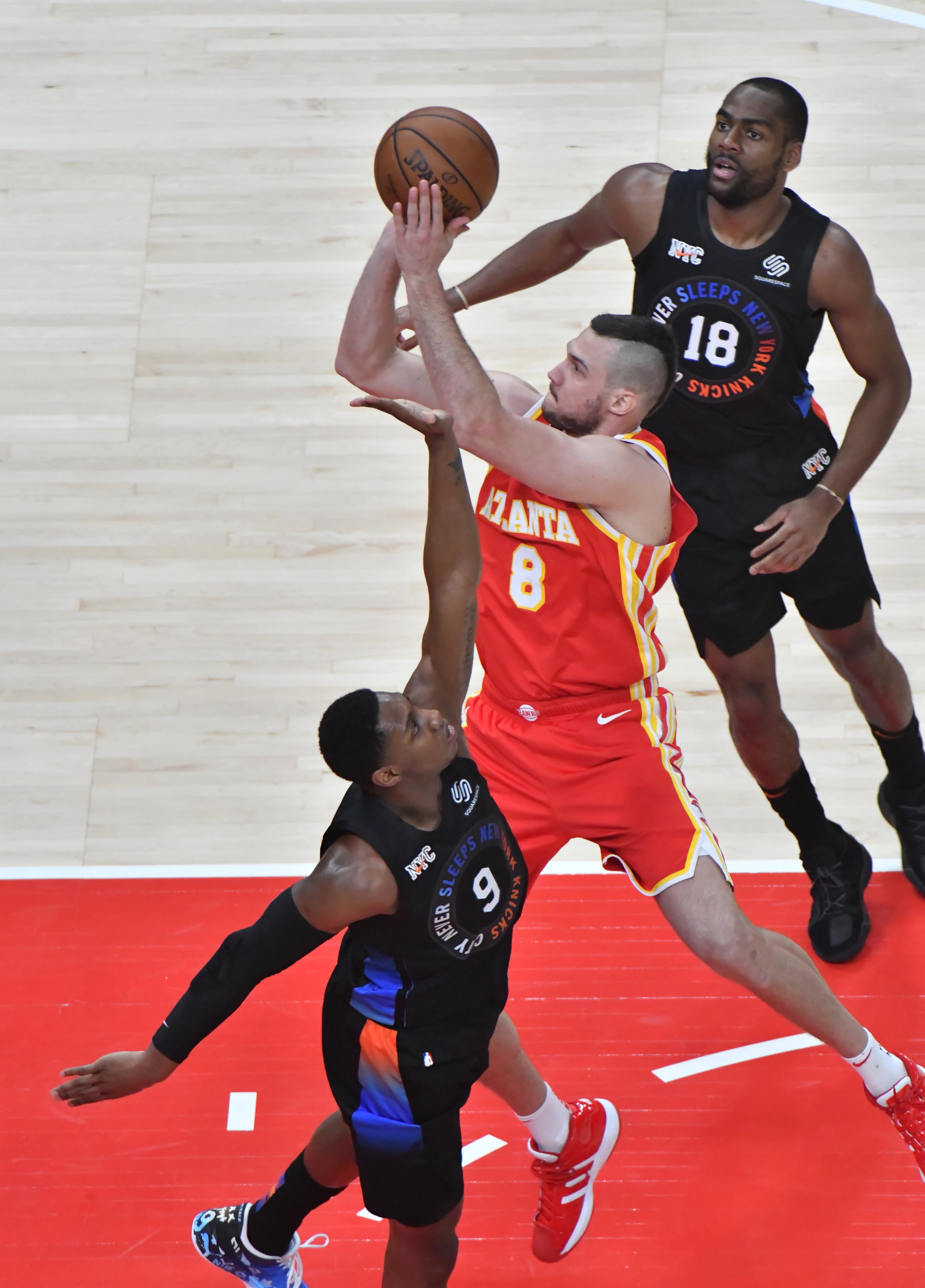 Atlanta Hawks forward Danilo Gallinari (8) shoots over New York Knicks guard RJ Barrett (9) during the first half in Game 3 of an NBA basketball first-round playoff series at State Farm Arena on Friday, May 28, 2021. (Hyosub Shin / Hyosub.Shin@ajc.com)