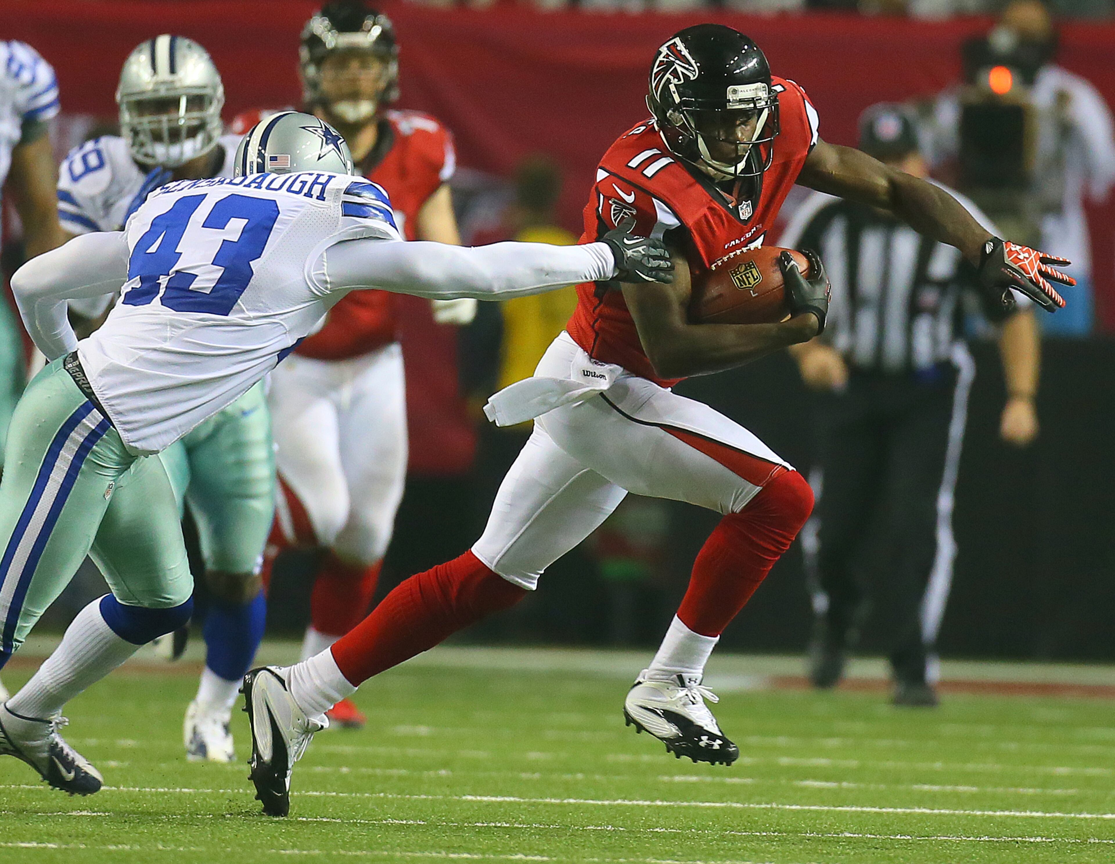 110412 ATLANTA: Falcons wide receiver Julio Jones gets past Cowboys safety Gerald Sensabaugh for a first down during fourth quarter action at the Georgia Dome in Atlanta on Sunday, Nov. 4, 2012. CURTIS COMPTON / CCOMPTON@AJC.COM