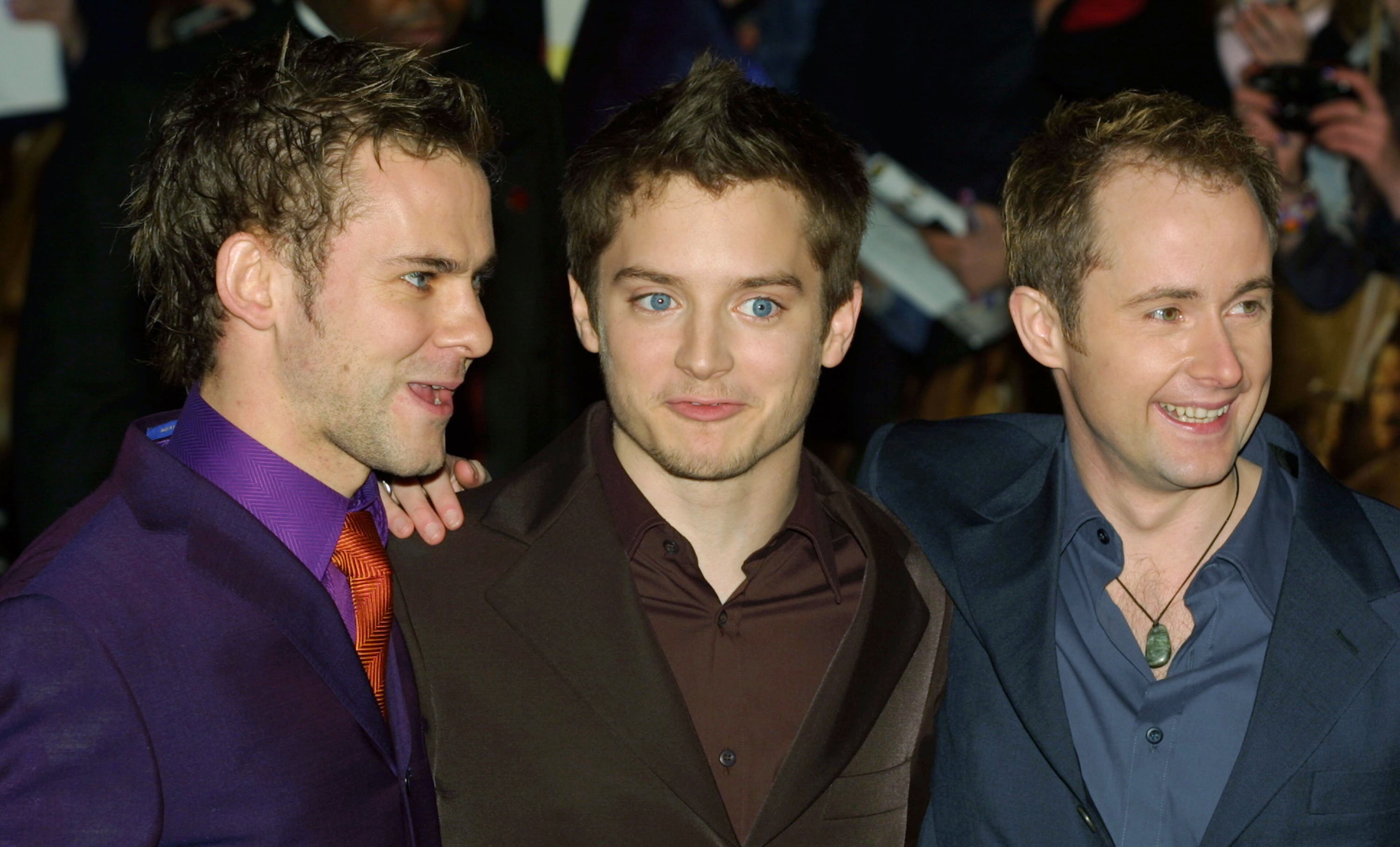 Actors Dominic Monaghan (left), Elijah Wood and Billy Boyd attend the world premiere of the movie "Lord of the Rings" Dec. 10, 2001, at the Odeon Cinema in London.