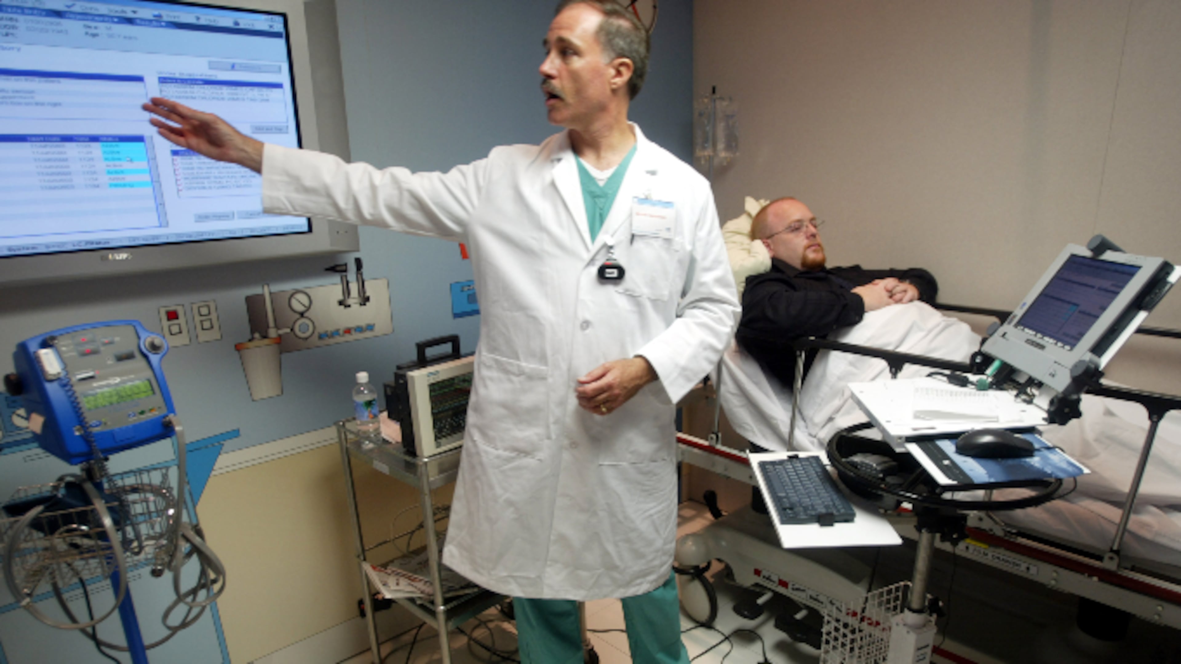 A physician consultant in Hollywood, Florida, gives a preview of a hi-tech system that will allow doctors and nurses to access patient information on wireless laptop computers at bedside.