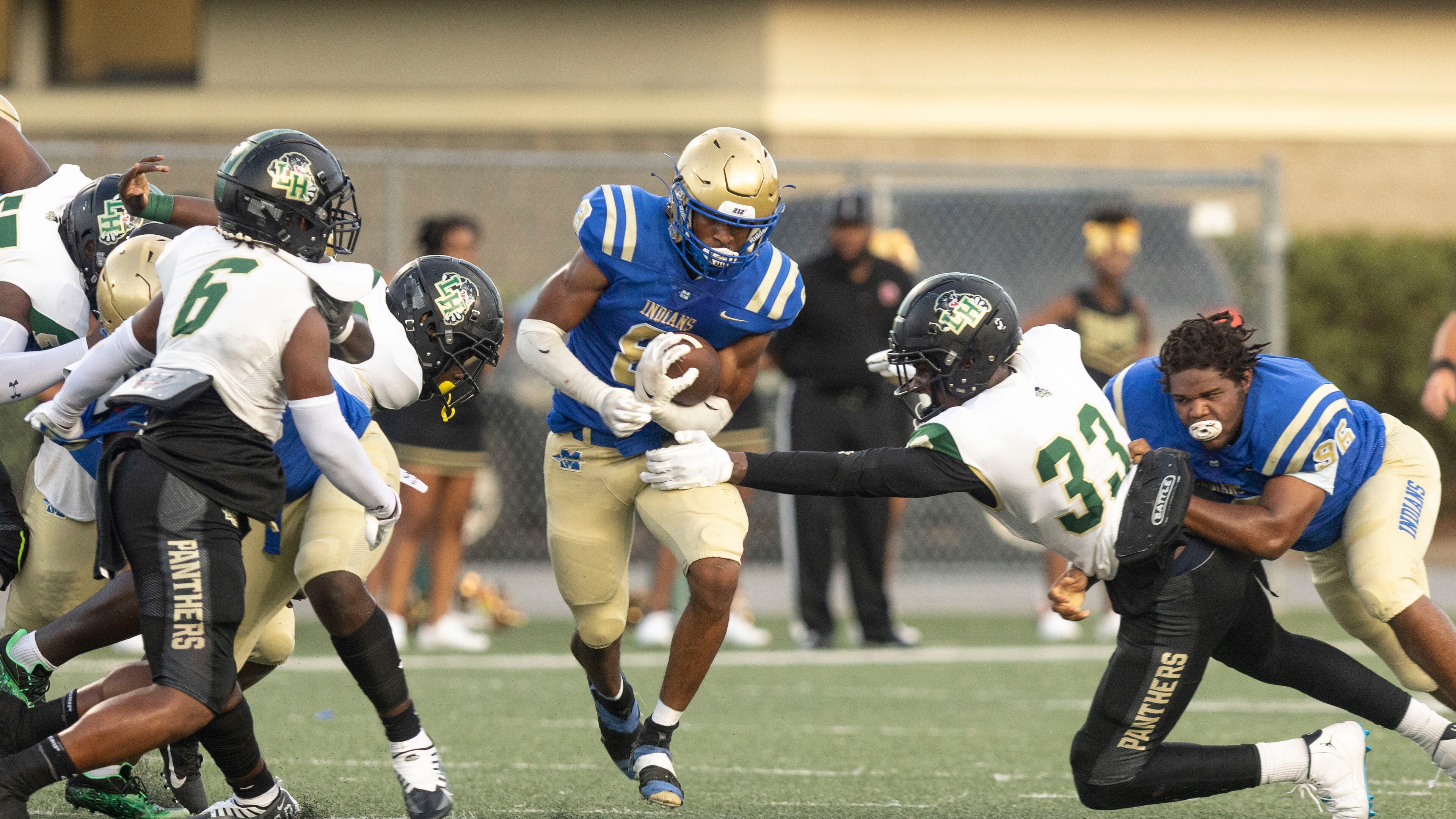 McEachern’s Jaylon Brown (8) runs the ball during a GHSA High School football game between Langston Hughes High School and McEachern High School at McEachern High School in Powder Springs, GA., on Friday, August 26, 2022. (Photo by Jenn Finch)