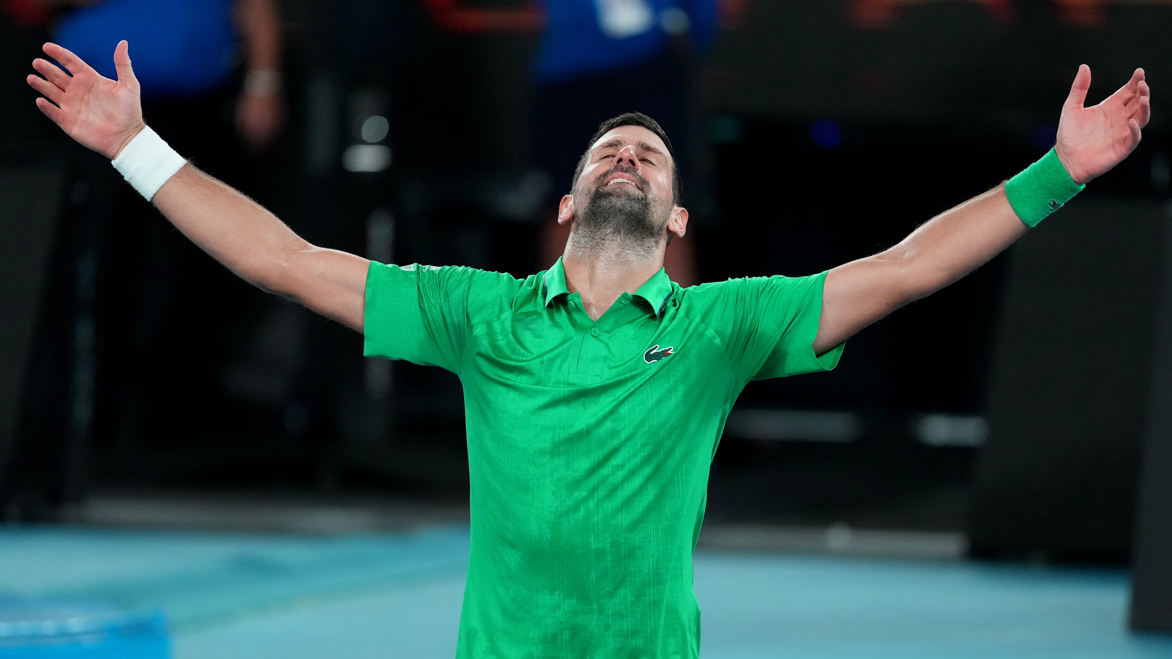Novak Djokovic of Serbia celebrates after defeating Jannik Sinner of Italy in their semifinal match at the Australian Open tennis championship in Melbourne, Australia, early Saturday, Jan. 31, 2026. (AP Photo/Asanka Brendon Ratnayake)