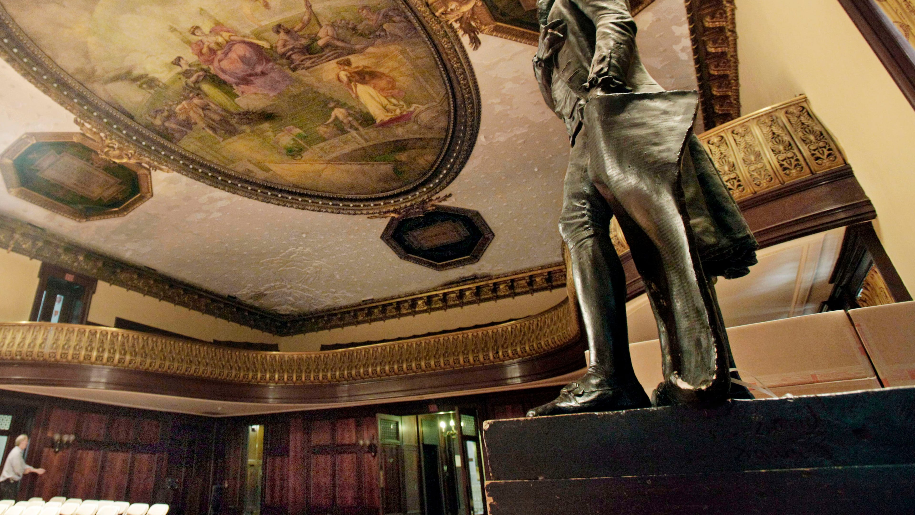 FILE - A statue of Thomas Jefferson, right, stands in New York's City Hall Council Chamber, July 14, 2010. (AP Photo/Richard Drew, File)
