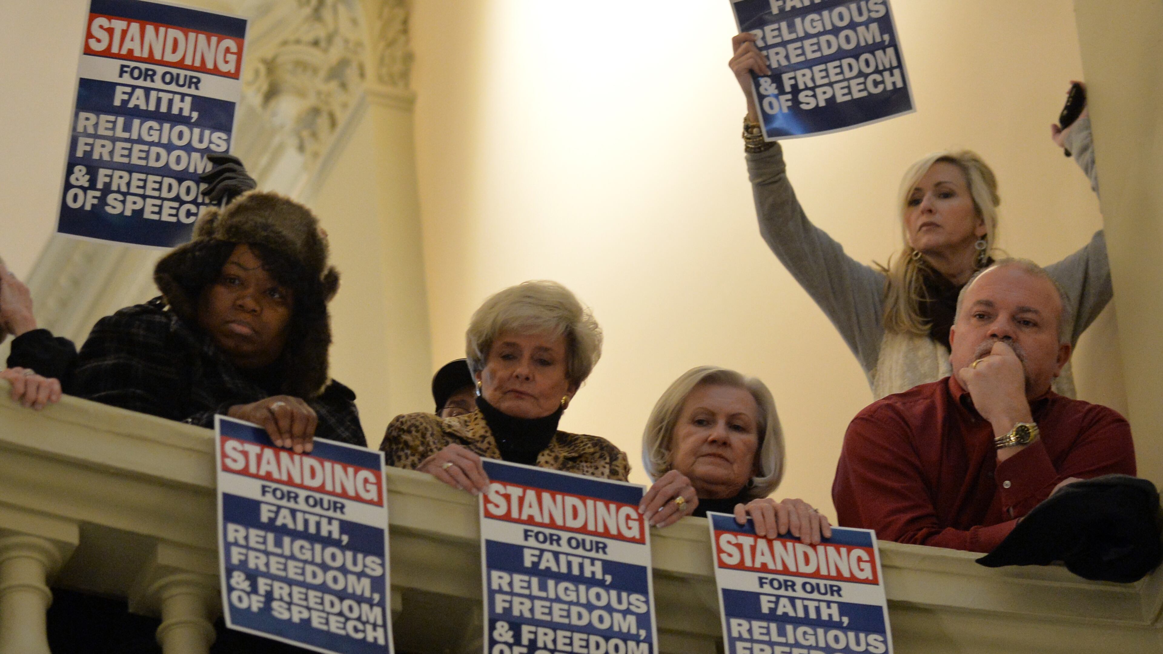 Supporters watch a Standing for Religious Freedom Rally last January at the state Capitol. BRANT SANDERLIN / BSANDERLIN@AJC.COM