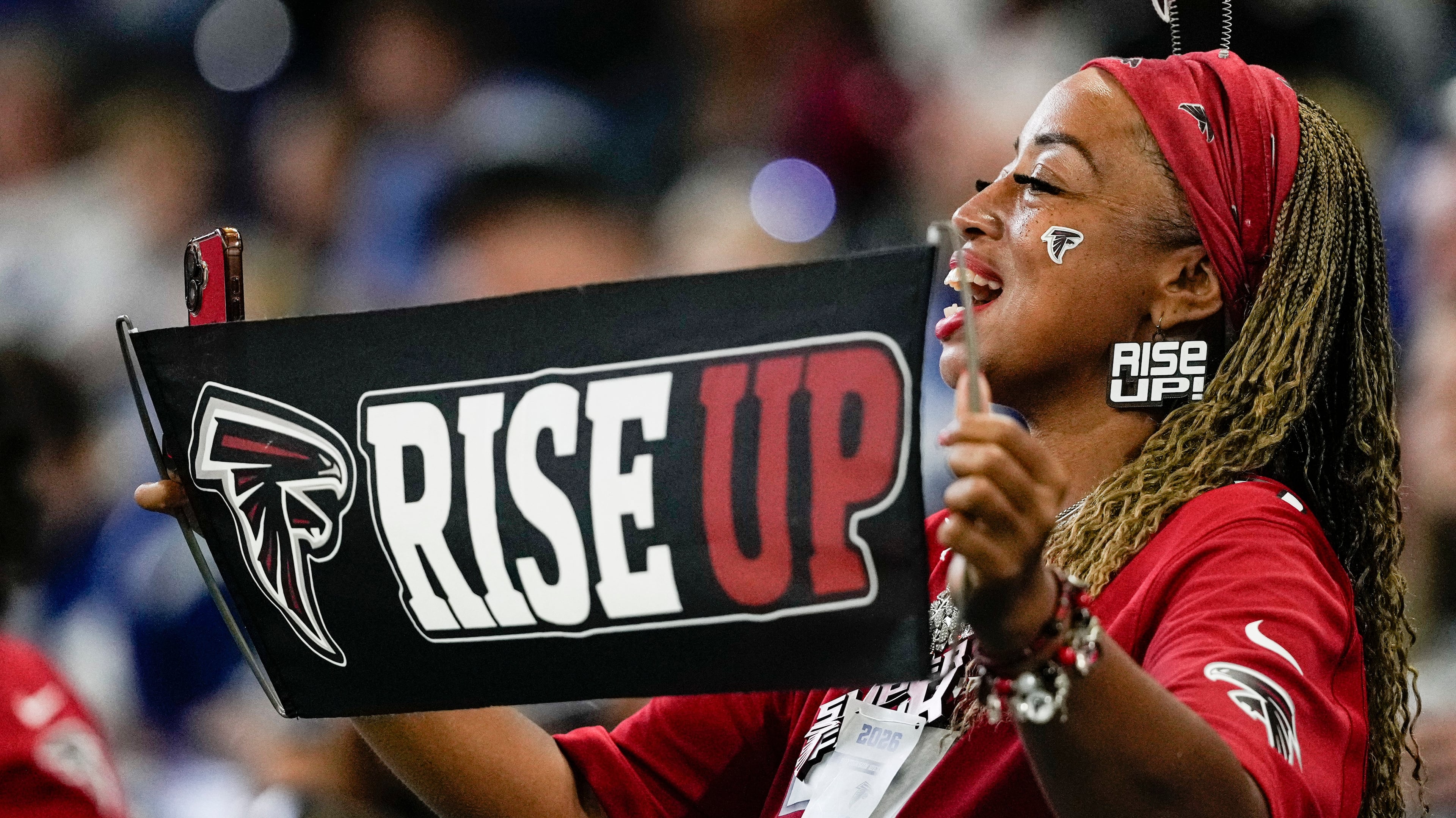 A Falcons fan cheers from the stands as Atlanta battles the Colts on Saturday, Aug. 22, 2026, in Indianapolis. Tonight, the Falcons take on the Packers at Green Bay’s Lambeau Field. (Nam Y. Huh/AP)
