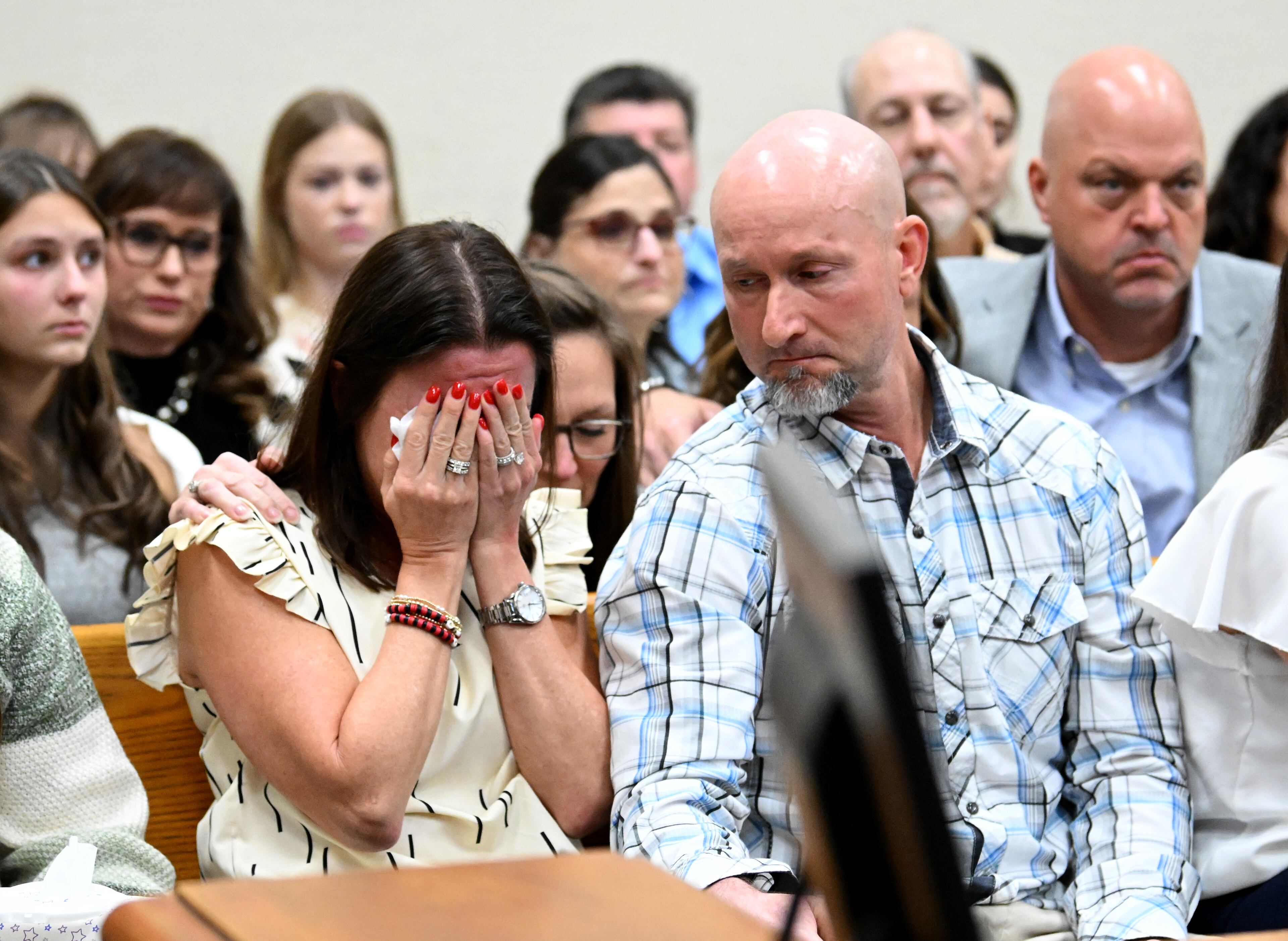 Allyson Phillips (left), mother of Laken Riley, reacts as John Phillips, stepfather of Laken Riley, comforts her during a trial of Jose Ibarra at Athens-Clarke County Superior Court, Friday, November 15, 2024, in Athens. Jose Ibarra was charged in the February killing of Laken Hope Riley, whose body was found on the University of Georgia campus. (Hyosub Shin / AJC)