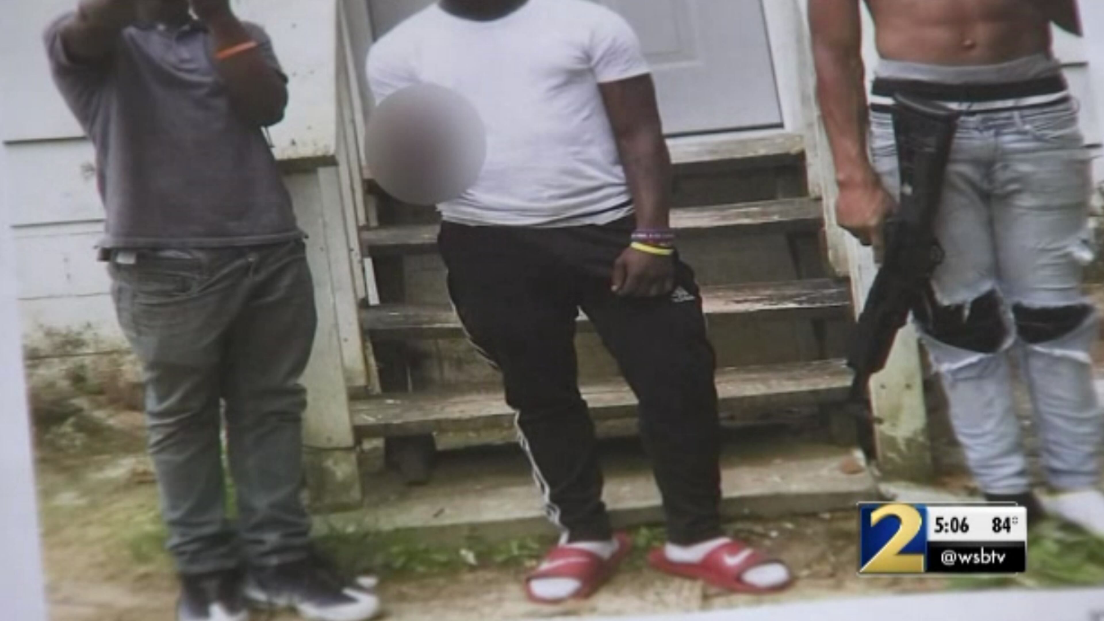 Three teenagers in Clayton County allegedly posted this photo to social media, showing them with a stolen firearm.