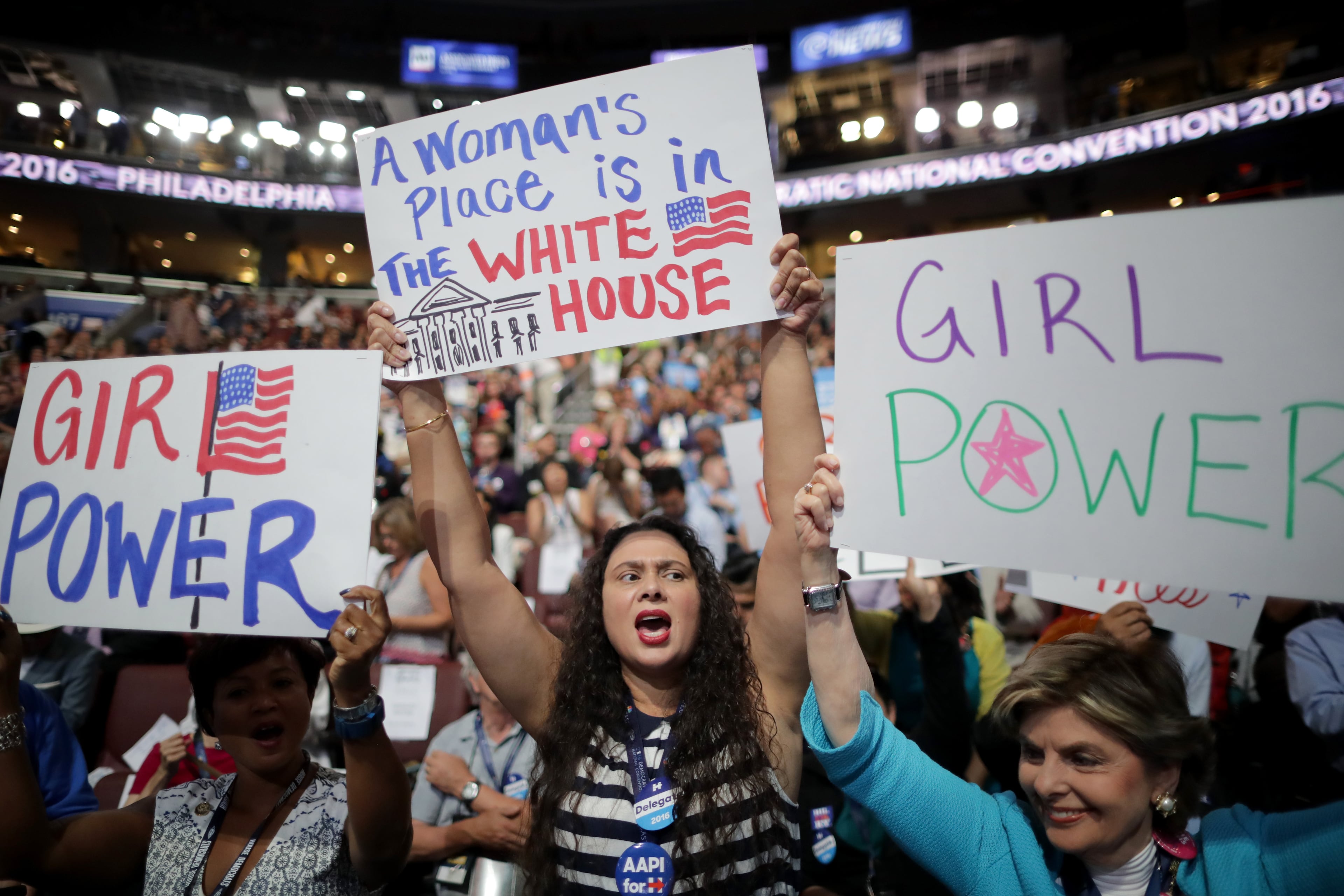 Delegates hold up signs in support of Democratic presidential candidate Hillary Clinton on the third day of the Democratic National Convention at the Wells Fargo Center, July 27, 2016 in Philadelphia. (Photo by Chip Somodevilla/Getty Images)