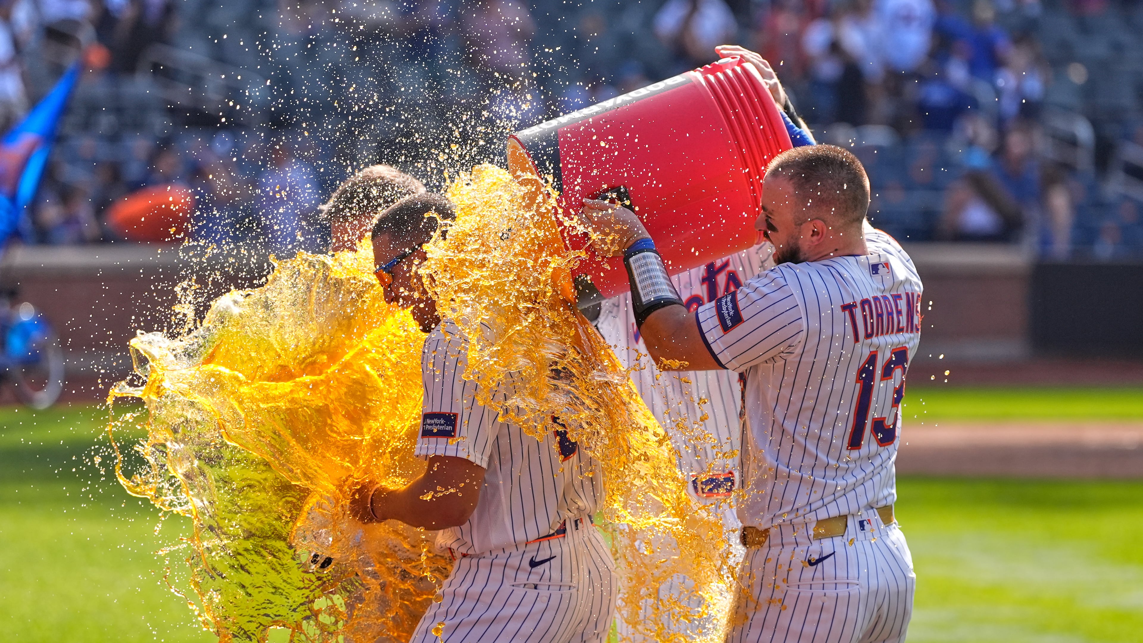 New York Mets' players dump a cooler on Tyrone Taylor, left, after a baseball game against the New York Yankees, Sunday, May 17, 2026, in New York. (AP Photo/Seth Wenig)