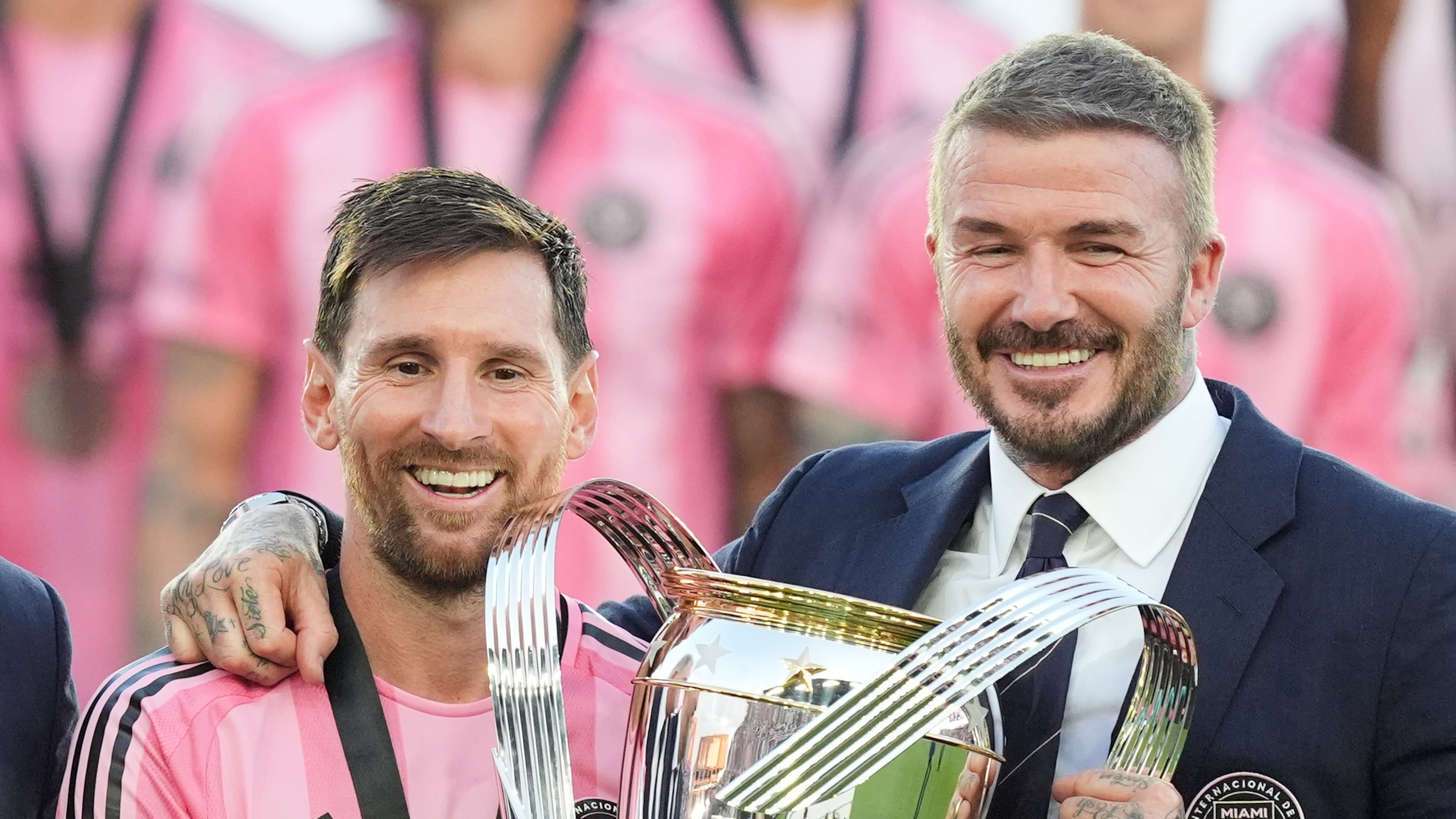 David Beckham poses with the MLS Cup trophy with Inter Miami forward Lionel Messi Saturday, Dec. 6, 2025, in Fort Lauderdale, Fla. (AP Photo/Rebecca Blackwell)