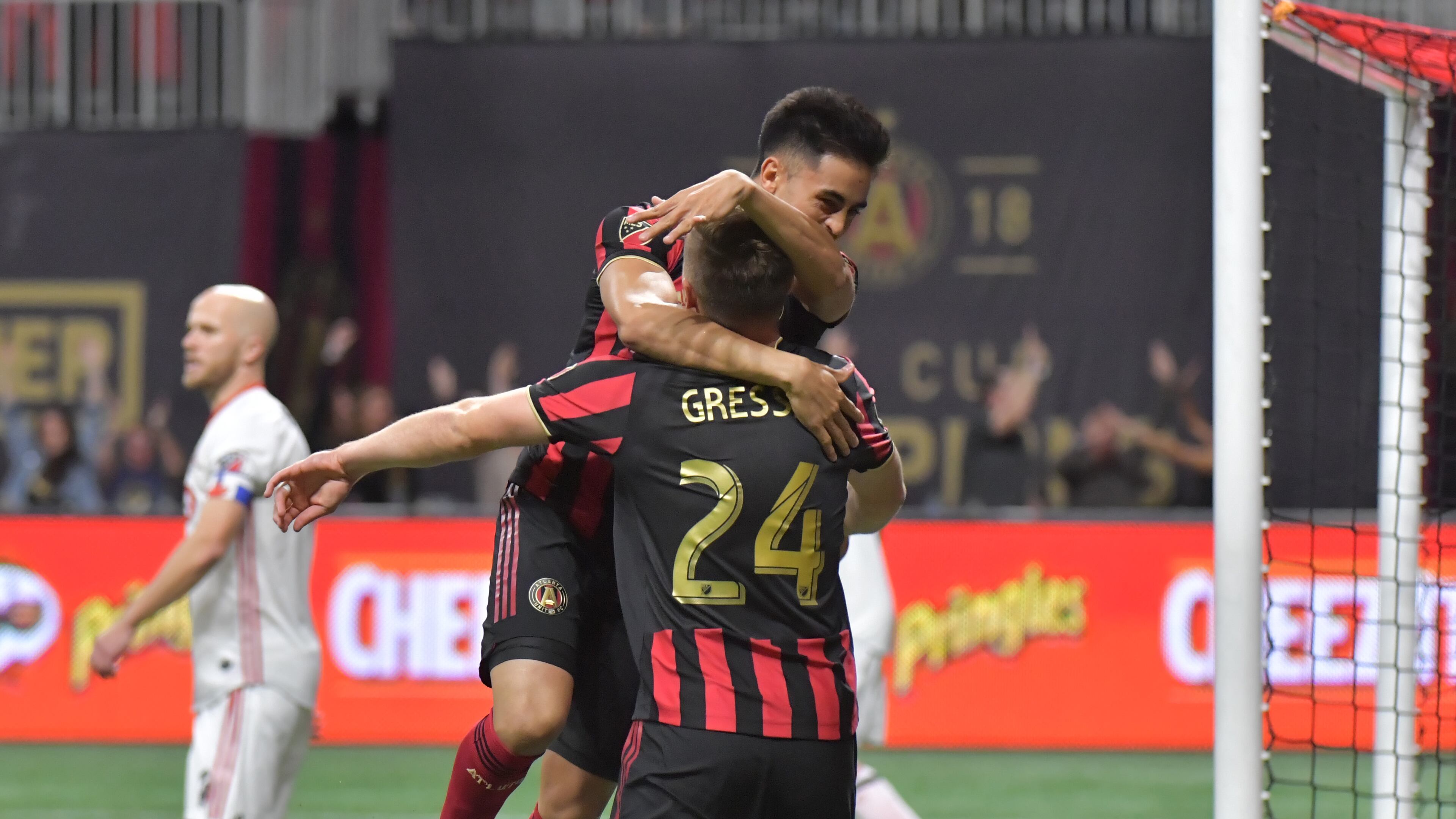 Atlanta United midfielder Gonzalo Martinez (10) celebrates with Atlanta United defender Julian Gressel (24) after Julian Gressel scored a goal in the first half during the Eastern Conference Final soccer match at Mercedes-Benz Stadium on Wednesday, October 30, 2019. (Hyosub Shin / Hyosub.Shin@ajc.com)