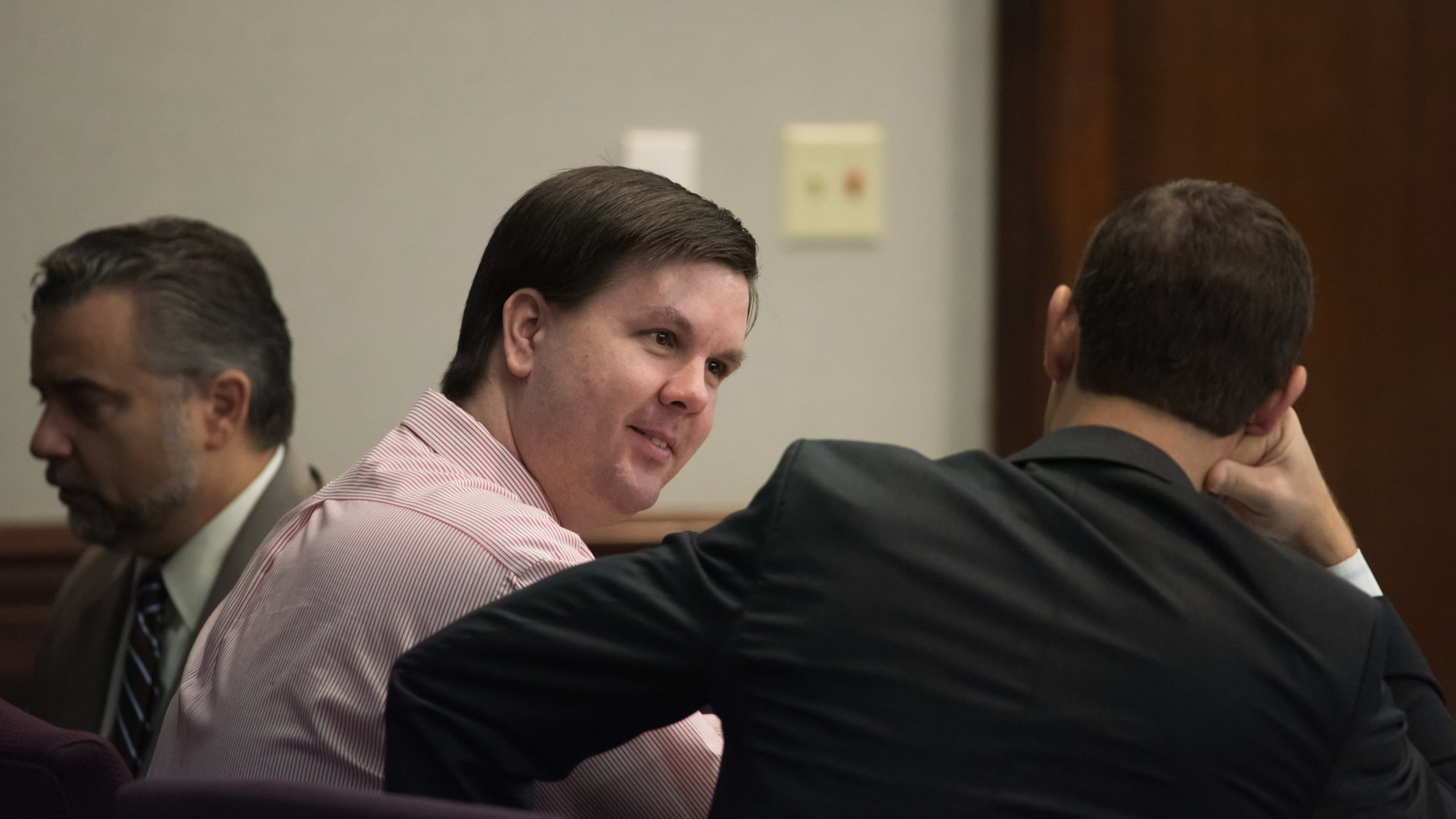 Ross Harris sits with his defense team as they prepare to turn over hundreds of exhibits of evidence to the jury on Tuesday. (Photo by John Carrington for the AJC)