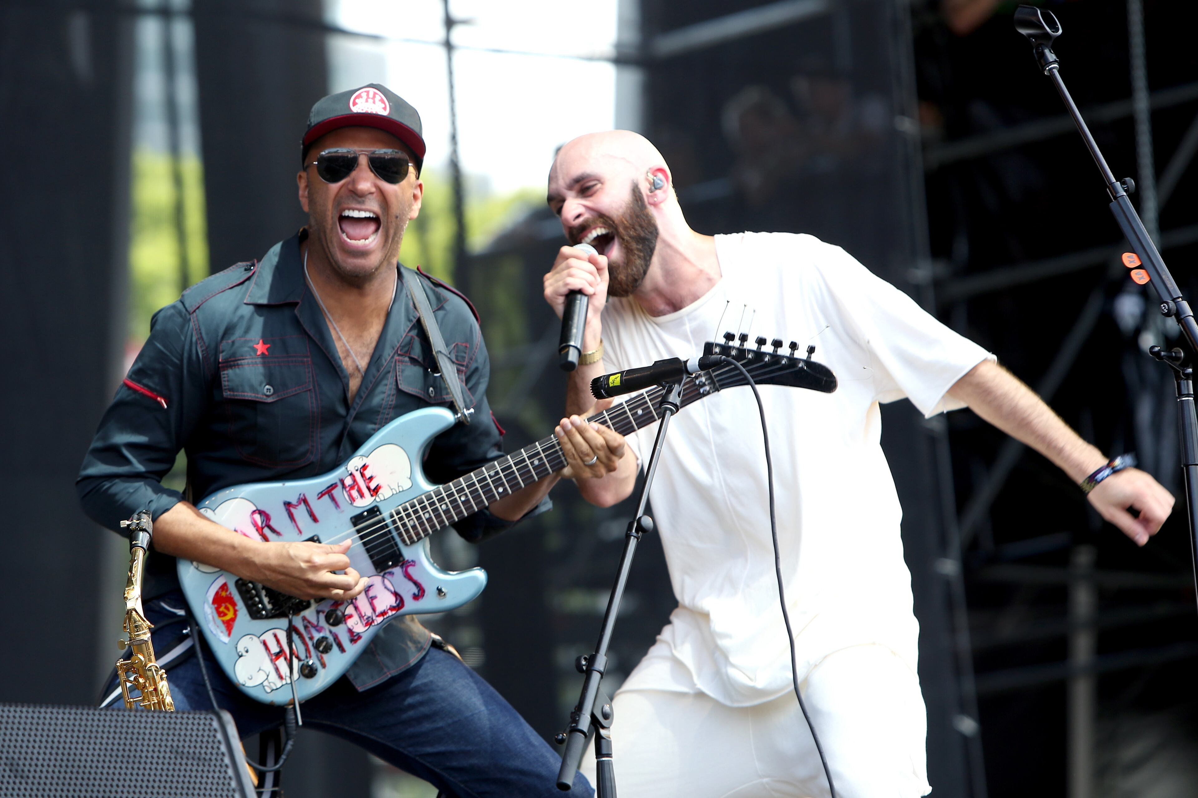 CHICAGO, IL - JULY 30: Musician Tom Morello (L) and recording artist Sam Harris of X Ambassadors perform on the Samsung Stage at Lollapalooza 2016 - Day 3 at Grant Park on July 30, 2016 in Chicago, Illinois. (Photo by Tasos Katopodis/Getty Images for Samsung)