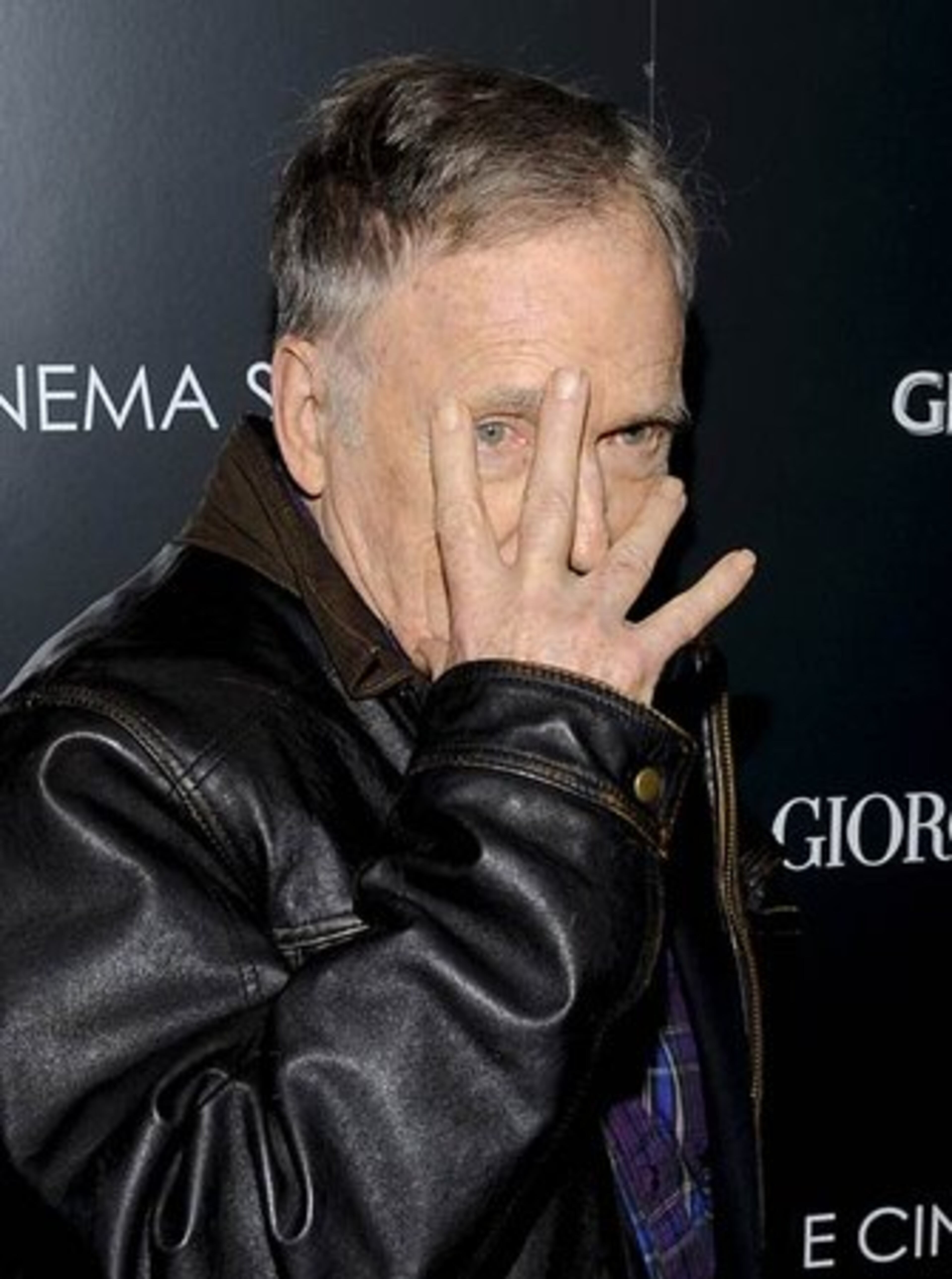 Television interviewer Dick Cavett jokes around for the cameras.