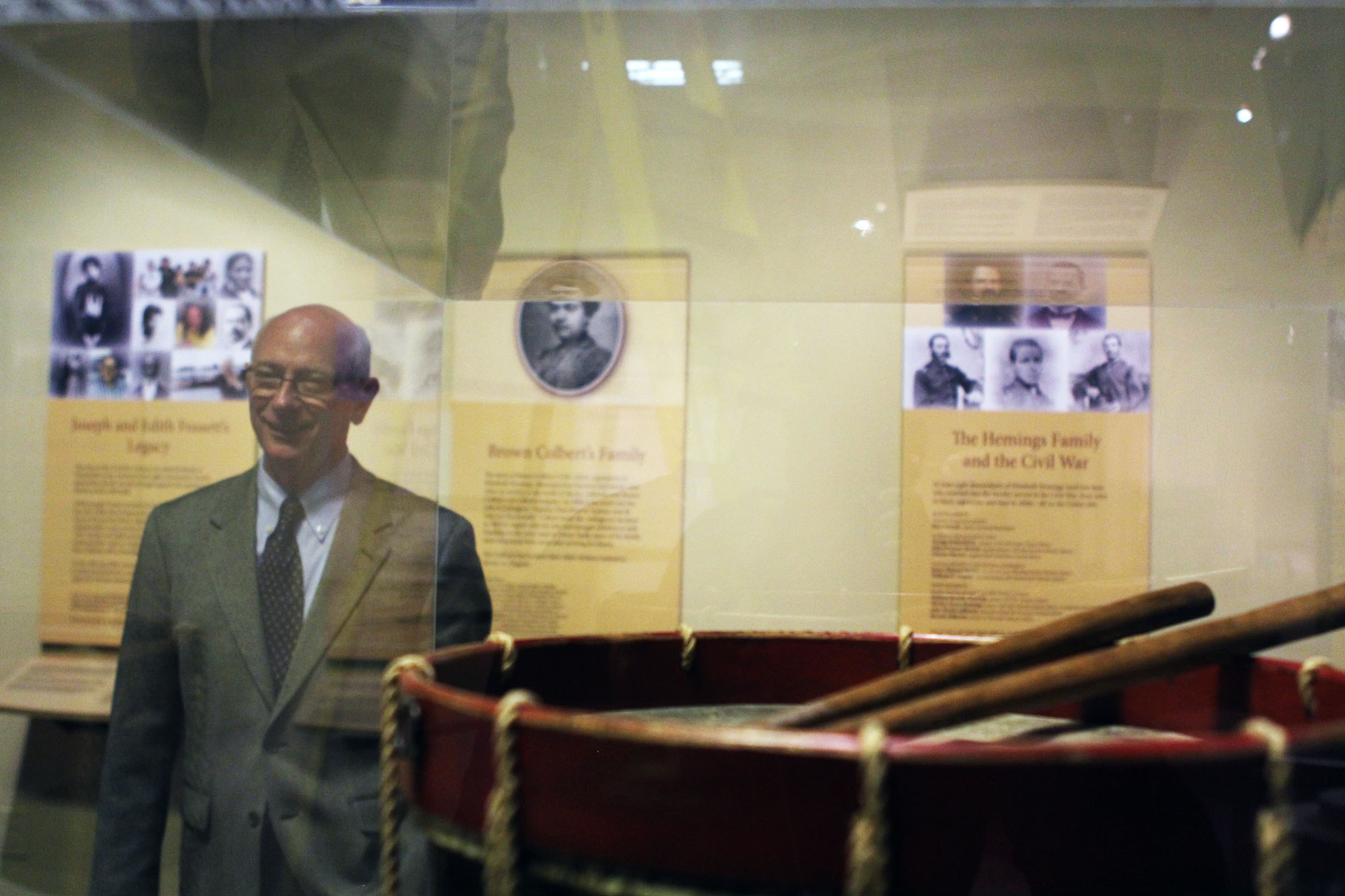 Michael Rose, Executive Vice President of the Atlanta History Center, stands next to a drum used by Sally Hemings' sons, who served in the Union Army during the Civil War.