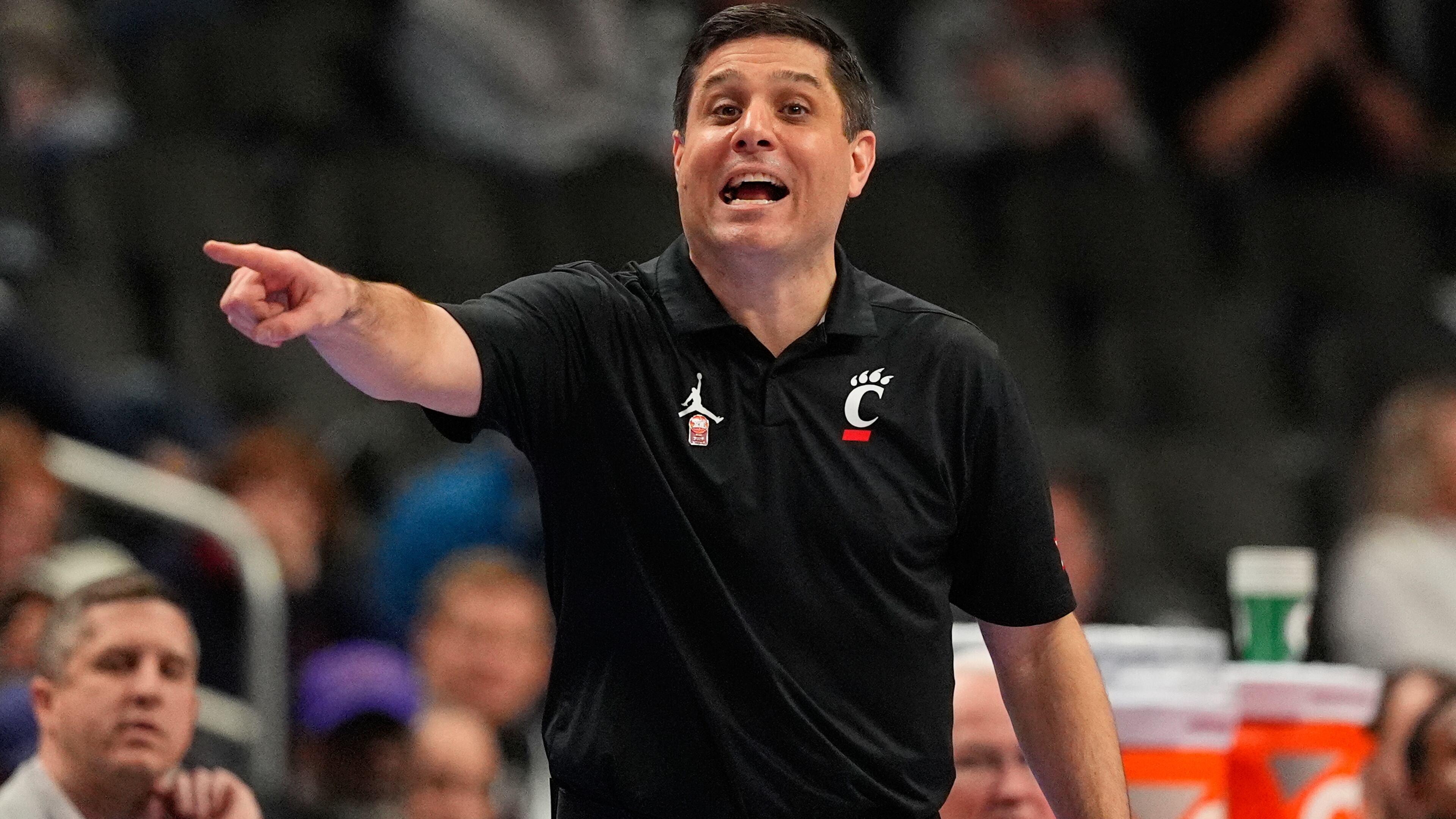 Cincinnati head coach Wes Miller is seen on the sidelines during the first half of an NCAA college basketball game against UCF in the second round of the Big 12 Conference tournament Wednesday, March 11, 2026, in Kansas City, Mo. (AP Photo/Charlie Riedel)