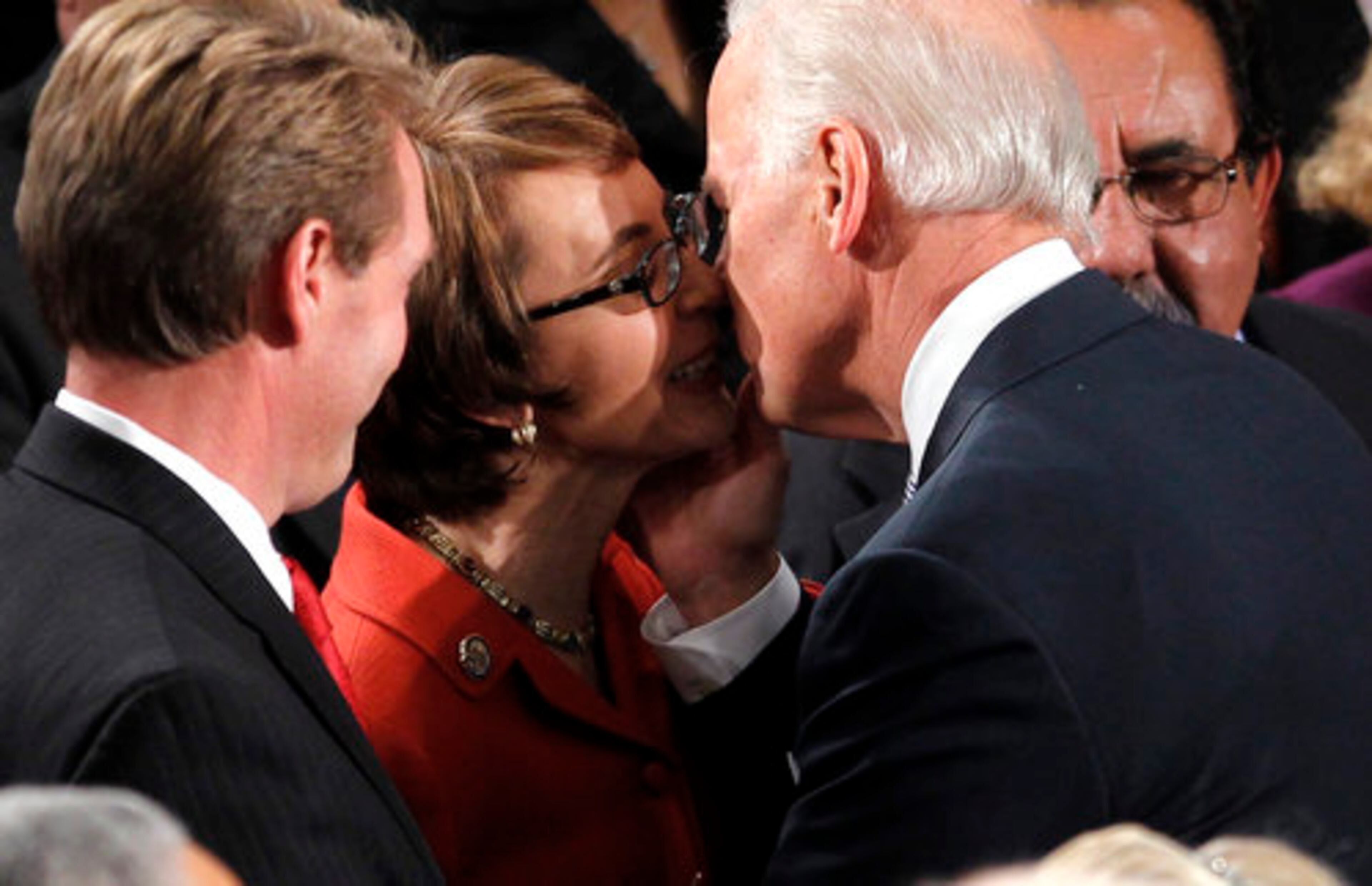 Vice President Joe Biden greets retiring Rep. Gabrielle Giffords, D-Ariz. on Capitol Hill in Washington, Tuesday, Jan. 24, 2012, prior to President Barack Obama's State of the Union address.