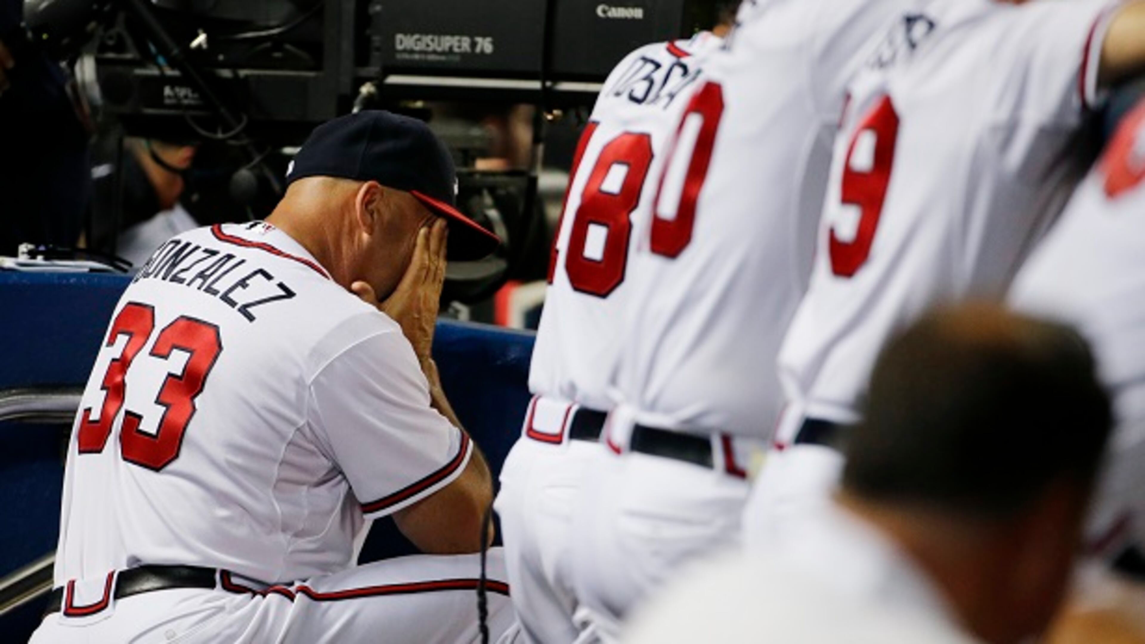 Atlanta Braves manager Fredi Gonzalez hangs his head in the dugout in the ninth inning of a game against the San Francisco Giants on Tuesday, Aug. 4, 2015, in Atlanta. (AP Photo/David Goldman)