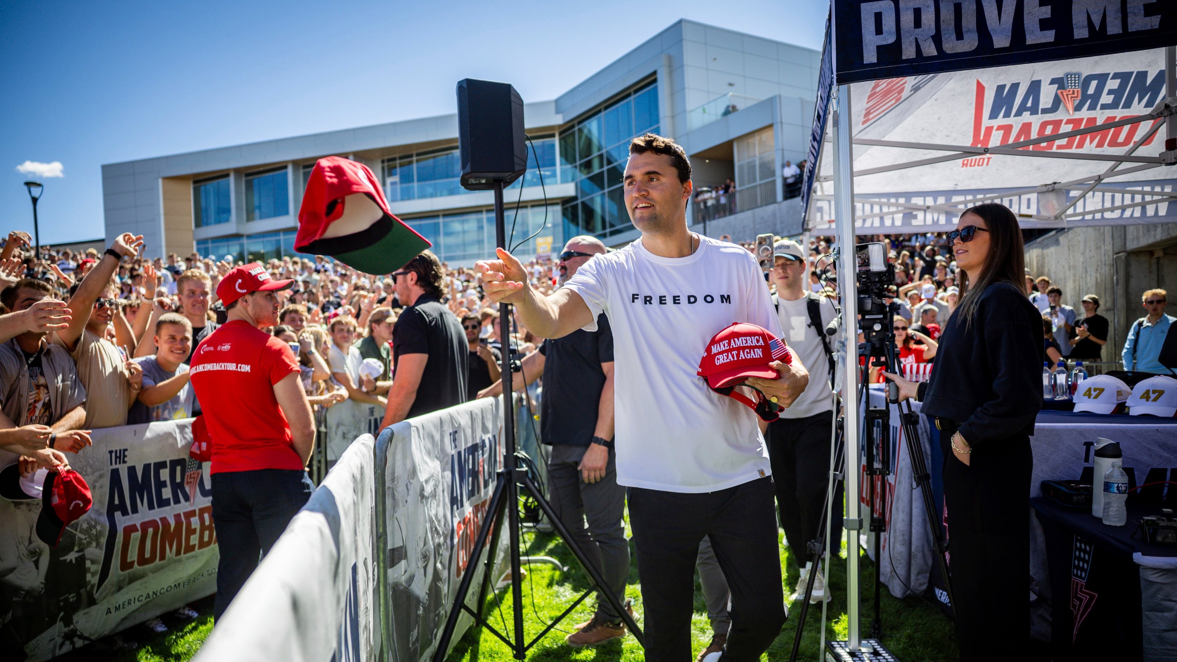 FILE - Charlie Kirk hands out hats before speaking at Utah Valley University in Orem, Utah, Sept. 10, 2025. (Tess Crowley/The Deseret News via AP, File)